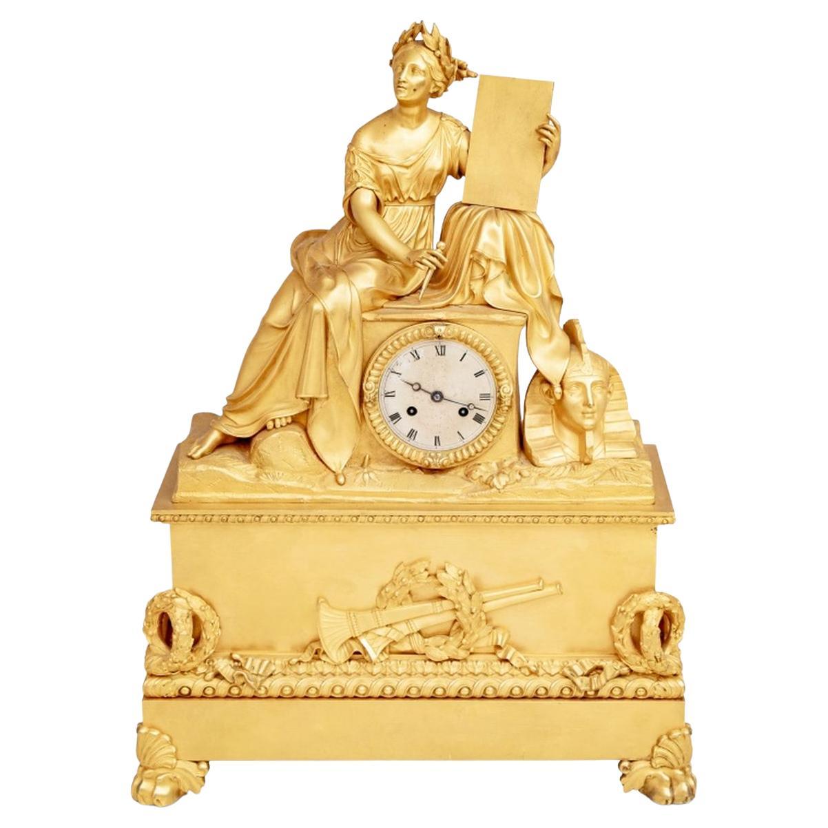 Orologio da tavolo figurato in bronzo dorato Charles X