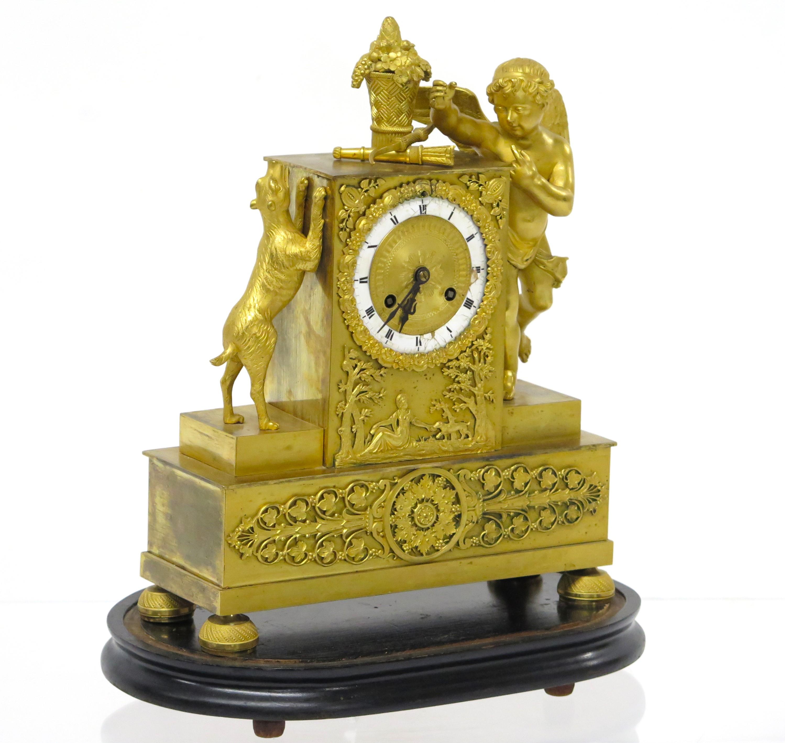 French Charles X Gilt Bronze Mantel Clock with Cupid and a Dog Stamped Bechot For Sale