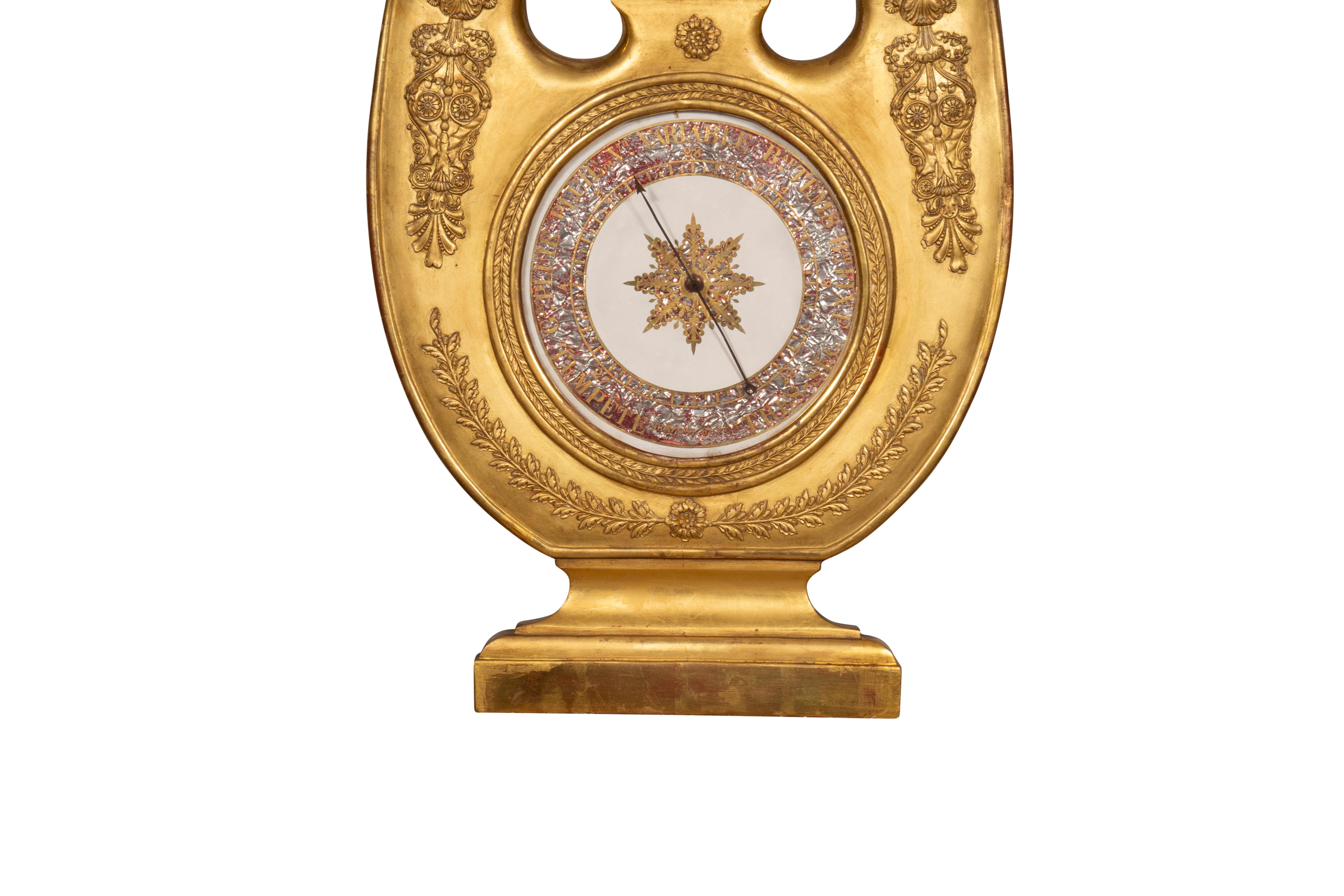 Lyre shape with very good water gilded surface. Circular dial.