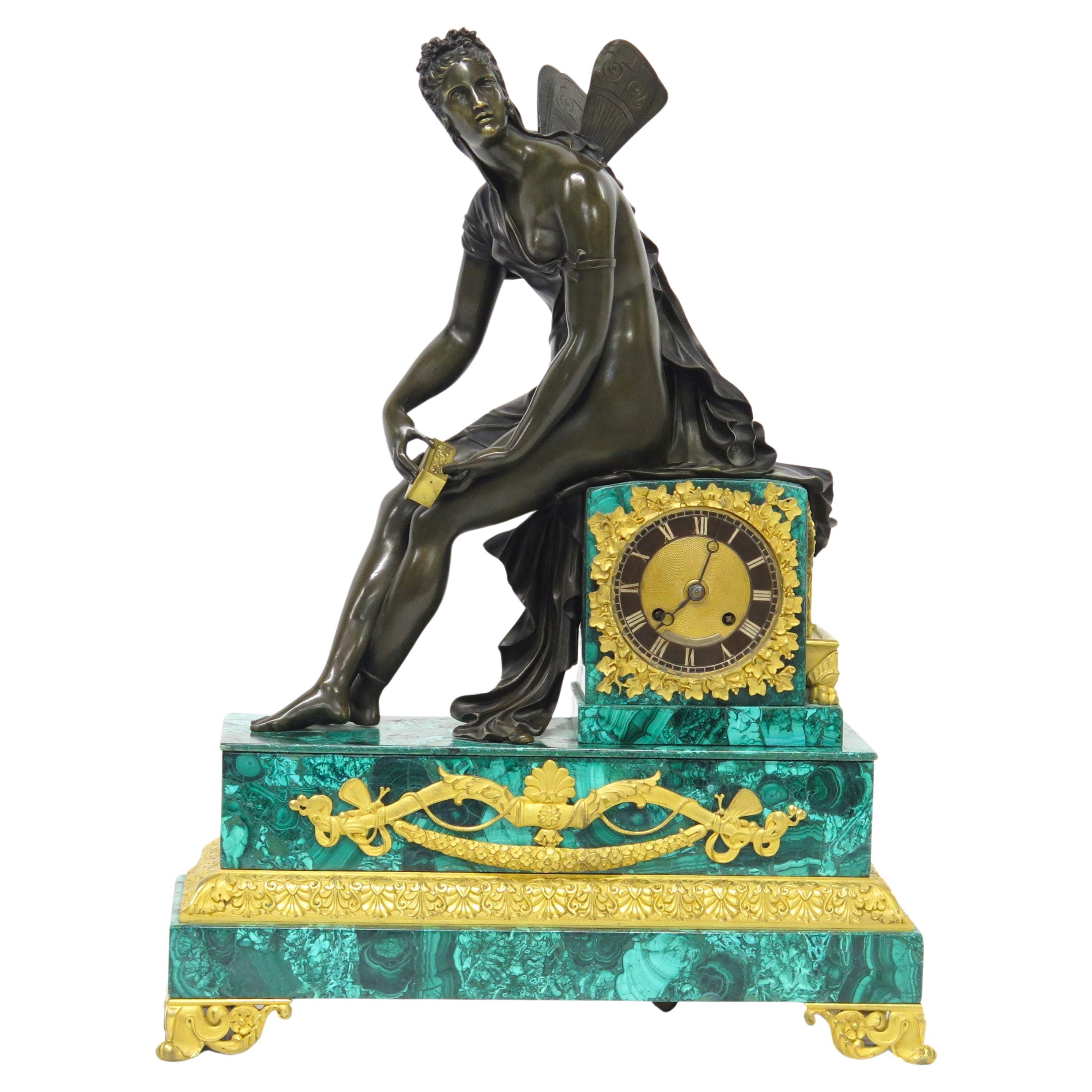 a very fine Charles X malachite and ormolu mounted mantle clock, depicting a seated Psyche, in patinated bronze, opening the golden box. France, circa 1830   

21