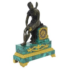 Pendule de cheminée Charles X en malachite et bronze doré représentant Psyché et la boîte dorée