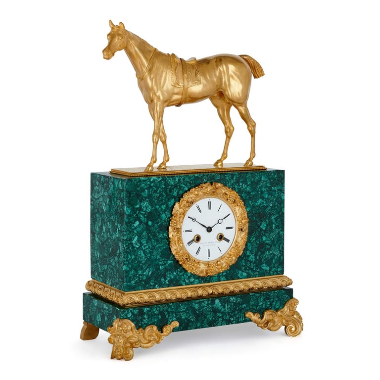 Charles X ormolu and malachite equestrian mantel clock
French, Early 19th century
Measures: Height 50cm, width 34cm, depth 15cm

In a malachite veneered case and mounted with ormolu decorations and sculptural surmount, this fine mantel clock is
