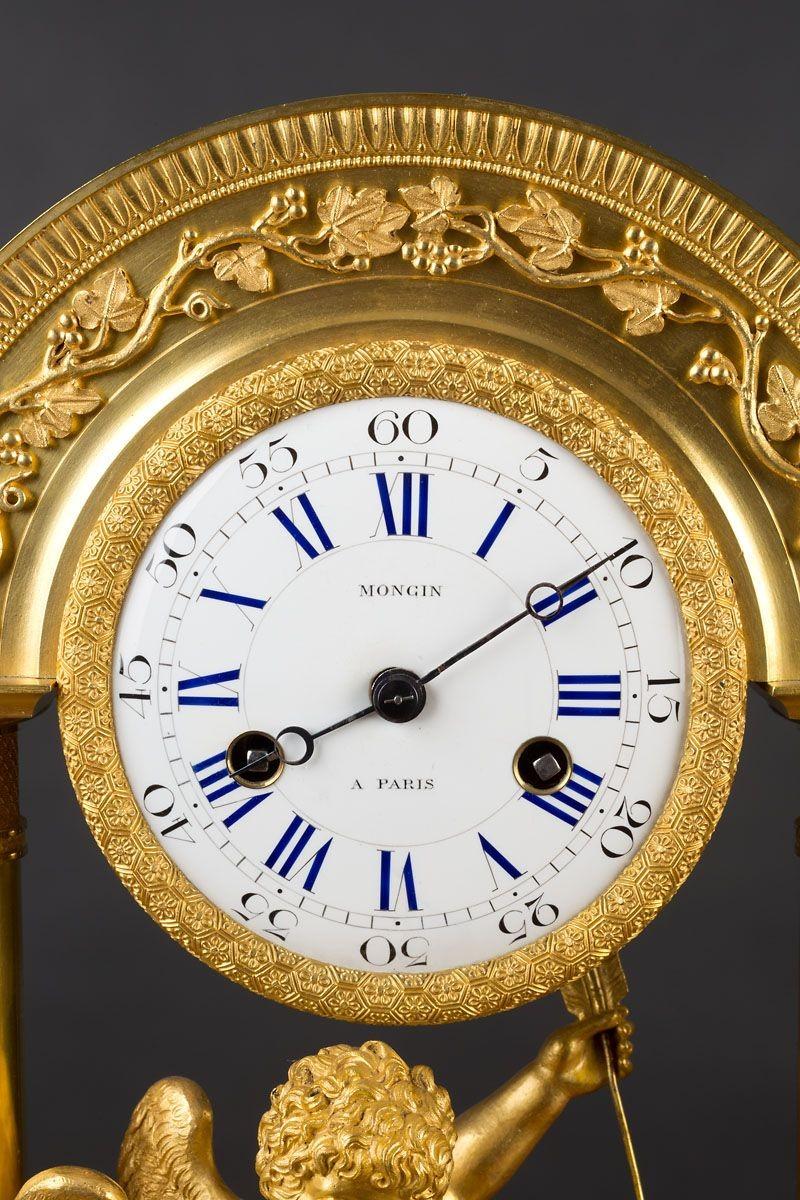 French Charles X Ormolu Mantel Clock
 
Rounded arched pillared case with fine ormolu floral mounts, chased decoration to the pillars standing on a raised plinth with applied mounts and resting on chased, compressed bun feet. Rectangular raised