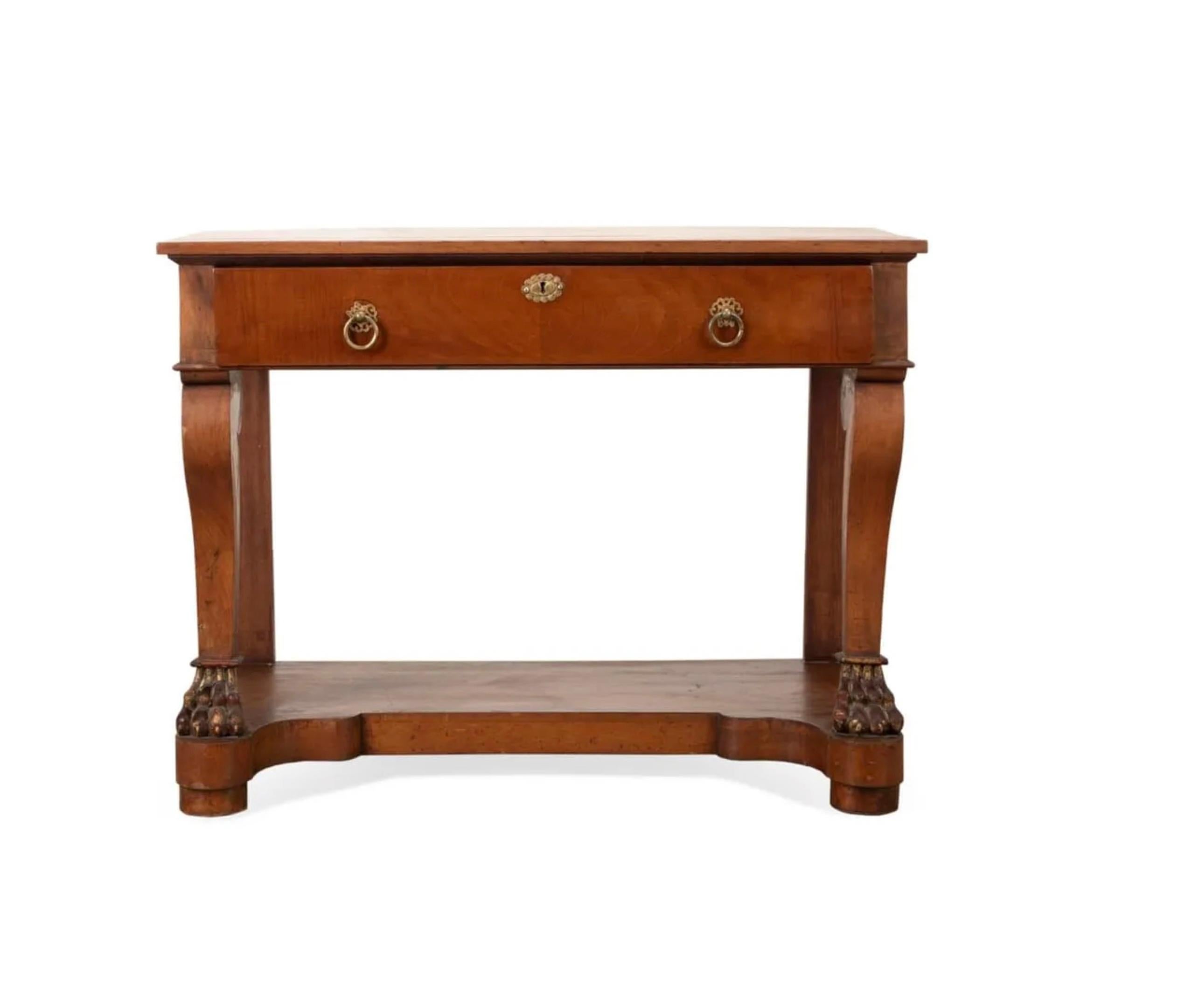 Continental, French, fruit wood Charles X console table, second half 19th century, having a rectangular top, over a shaped frieze with a single drawer, supported on scroll legs terminating in animal's paws, resting on a platform base having block