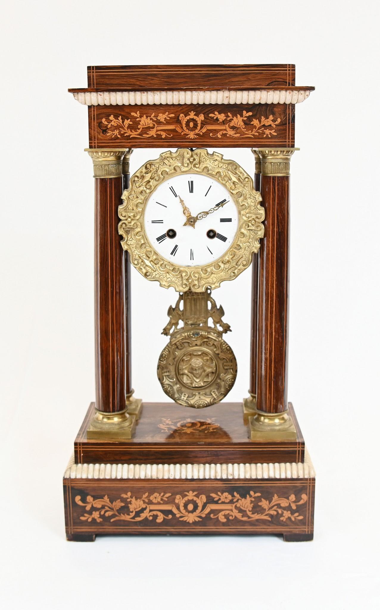Gorgeous antique French portico mantle clock 
We date this clock to circa 1810 hence it is Charles X
Classic portico clock with the classical columns either side of the face
Beautiful interplay of colours between the mahogany, inlay and gilt for the