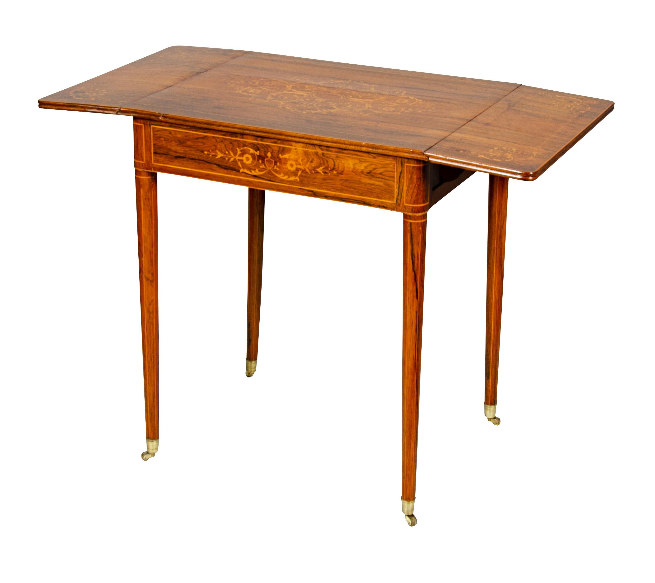 Rectangular top with drop leaves over a drawer raised on circular tapered legs. Provenance; Bellevue Ave Newport family.