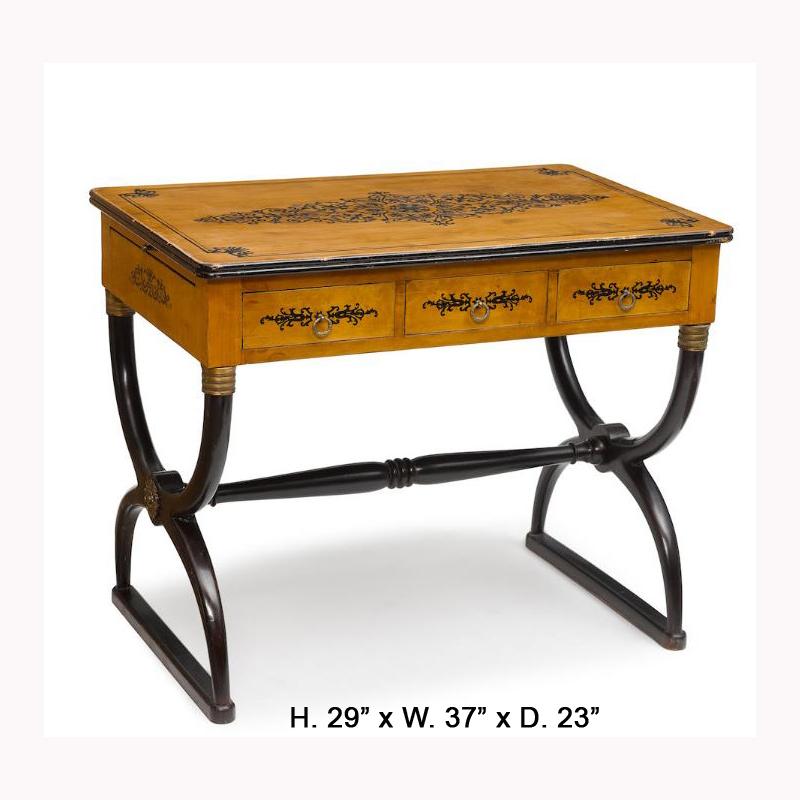 Attractive French Charles X style stenciled and part ebonized fruitwood writing table with two side slides. 
Late 20th century. 
The moulded rectangular top is with a stenciled central panel depicting scrolls and foliate, above a conforming frieze