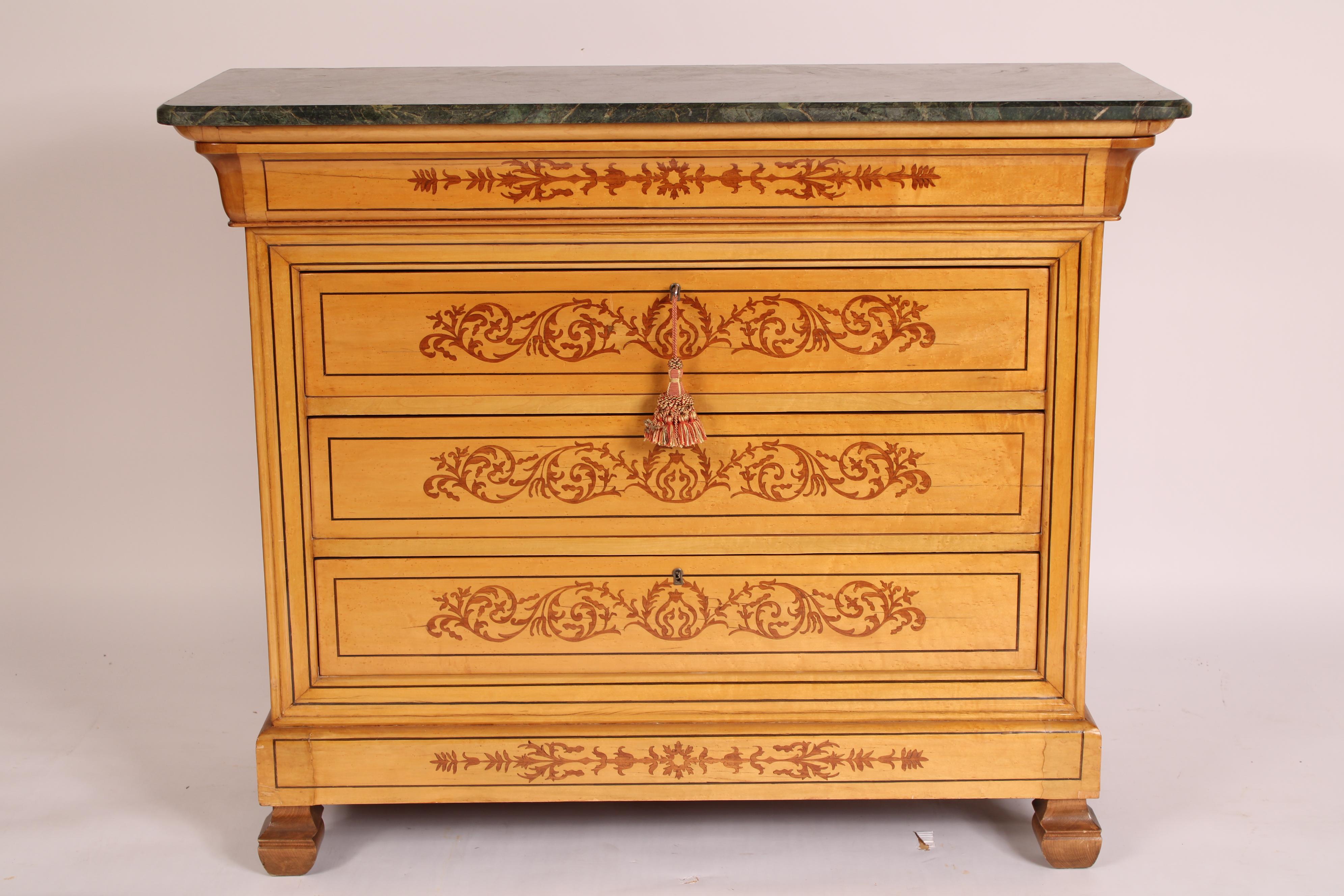 Charles X Inlaid chest of drawers with a marble top, circa 1980's. With a rectangular marble top with rounded front corners and beveled front and side edges, a small inlaid top drawer and 3 inlaid lower drawers with scrolling vine style inlay,