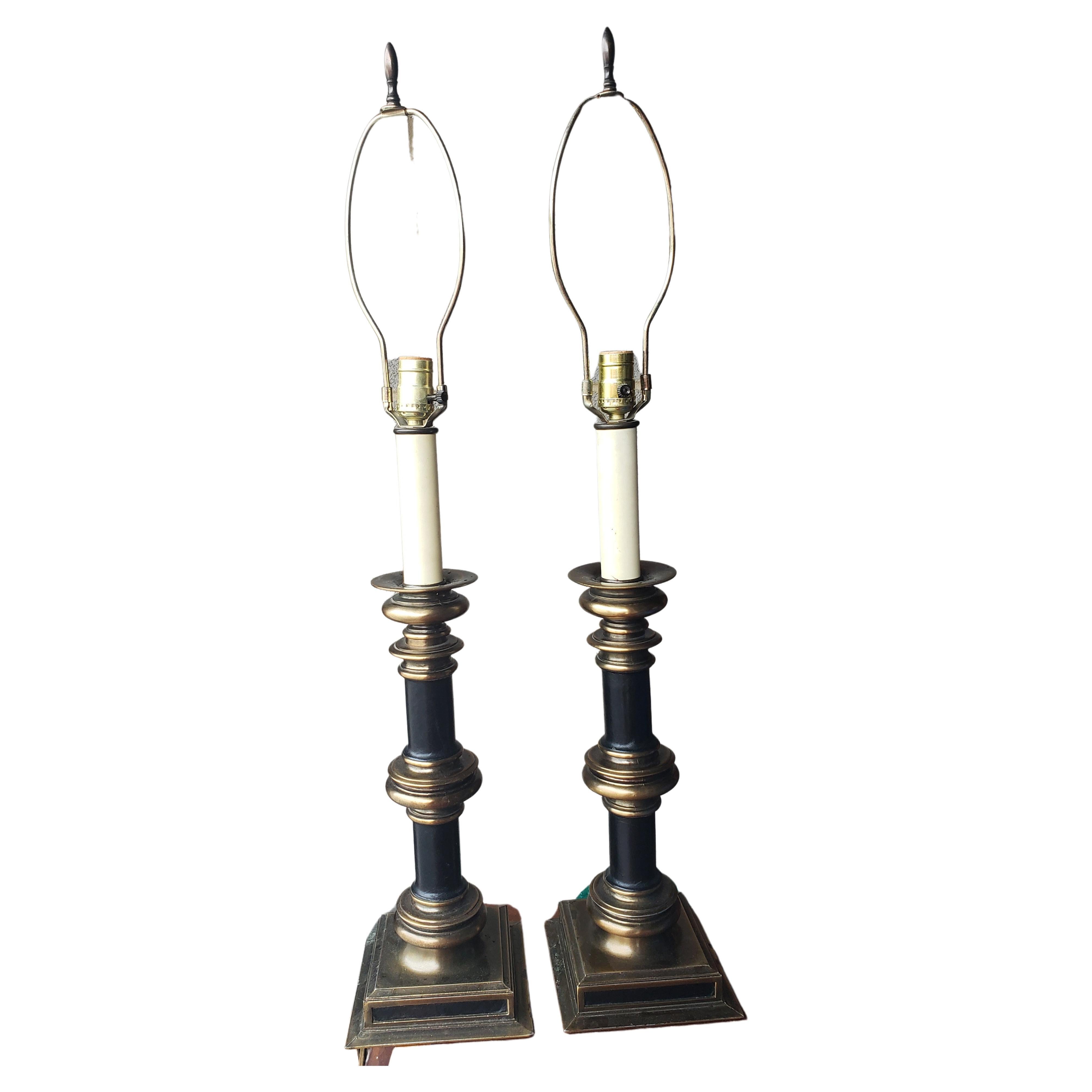 A fabulous pair of Charles X style black leather Mounted Patinated metal columnar table lamps.
Measures 7