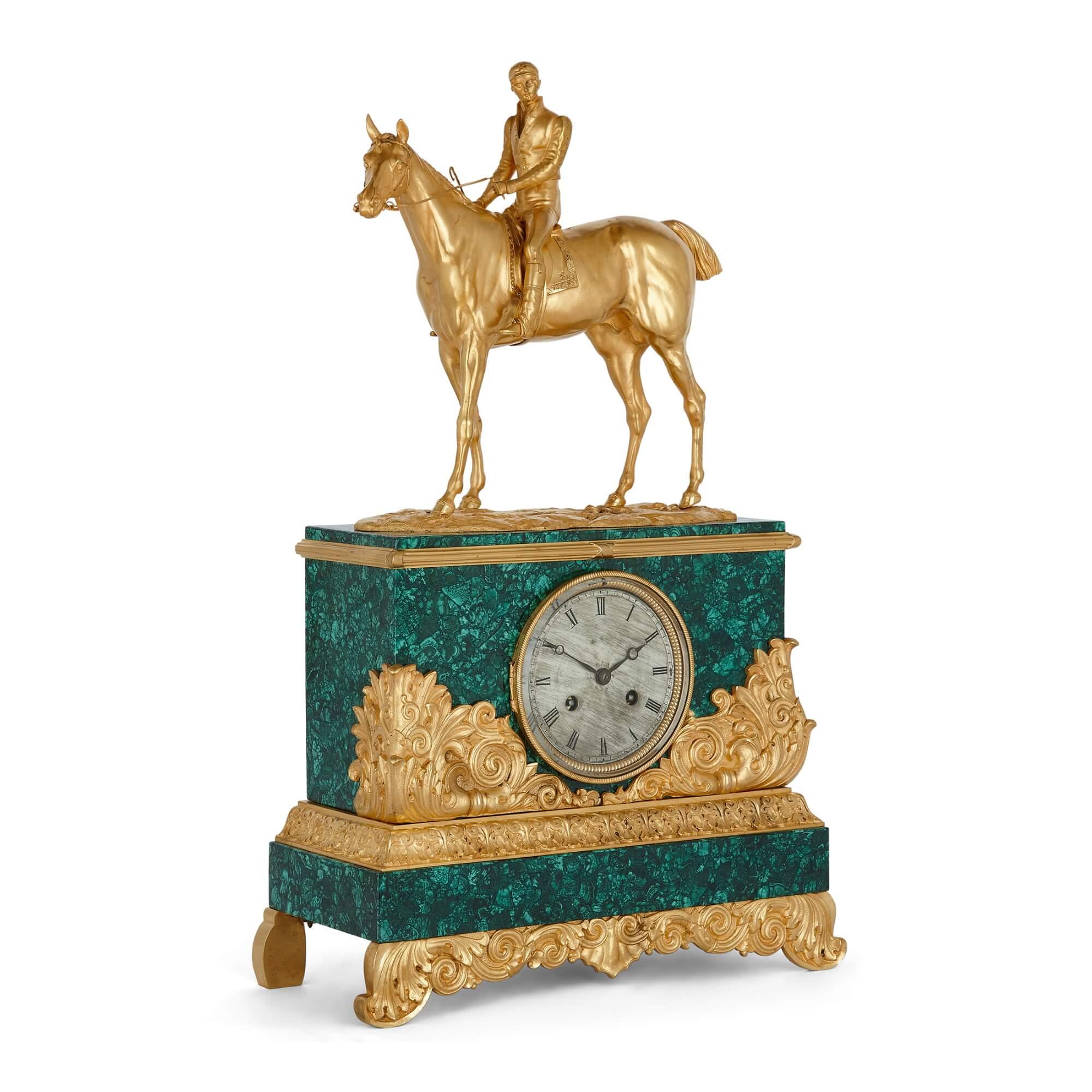 Charles X Style ormolu and malachite mantel clock with horse and jockey
French, 19th Century
Height 56cm, width 34cm, depth 14cm.

This exceptional piece is a fine ormolu-mounted and malachite mantel clock, with a movement made and stamped by
