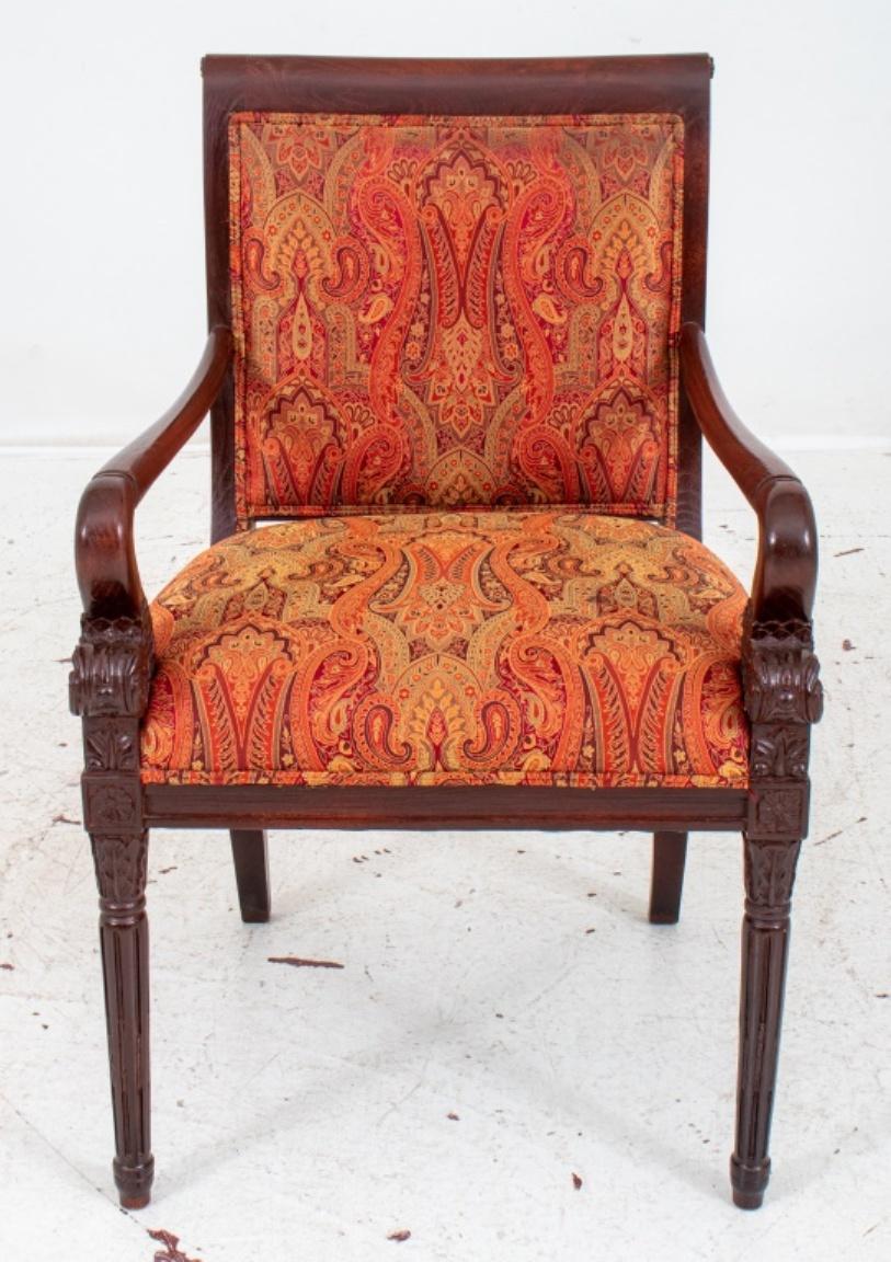 Scroll Arm Chair with rectangular back and down swept arms terminating in acanthus and fish scale volutes, above a square seat on paterae-headed tapering quiver-form stop fluted legs on toupie feet. 

Dimensions: 36