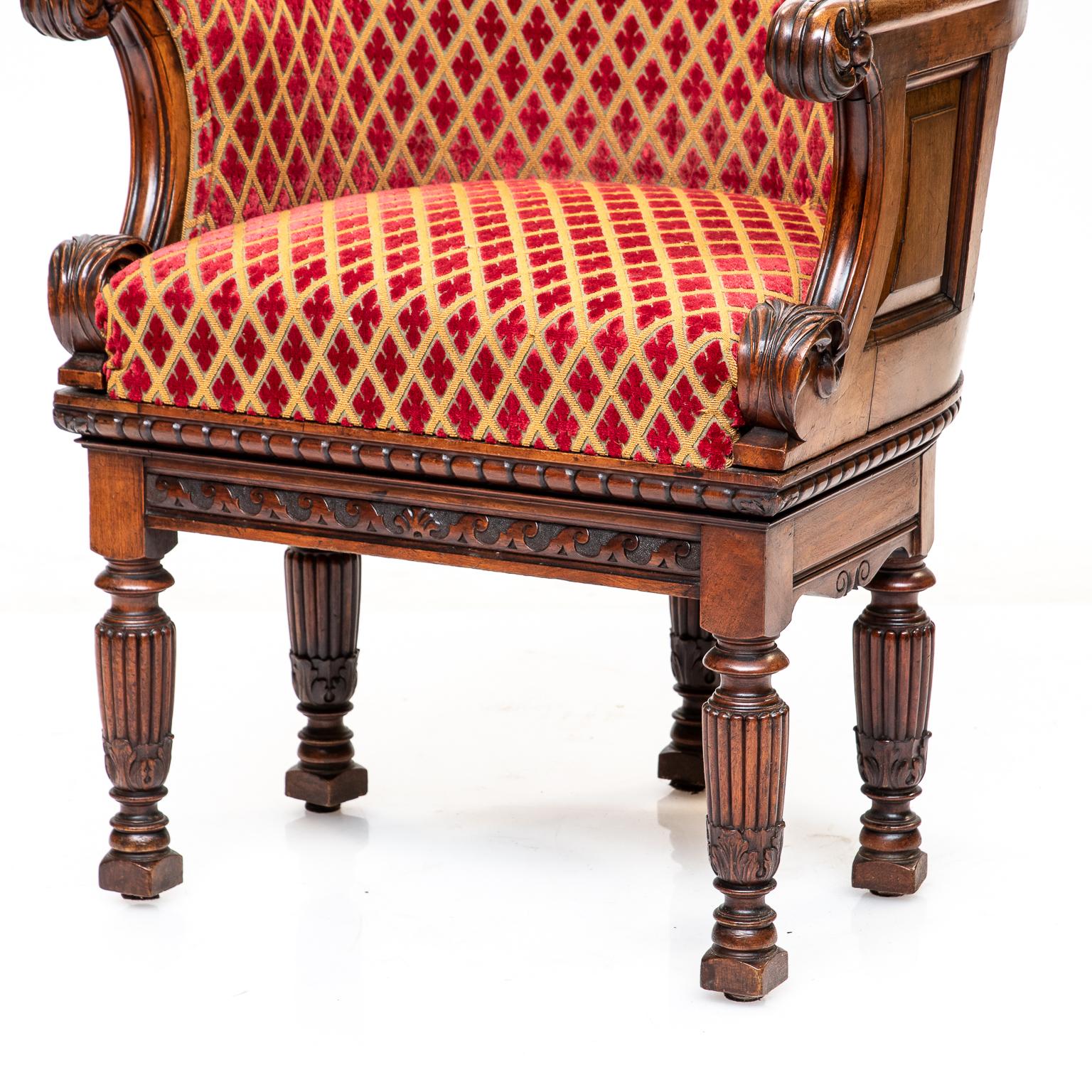 Charles X style walnut barrel back chair. Very nice condition. Nice panelled back, superb carvings, and reeded legs. Upholstery is in very good condition and makes this chair. Very comfortable.