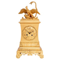 Pendule en bronze doré Charles X "Le serpent et l'aigle
