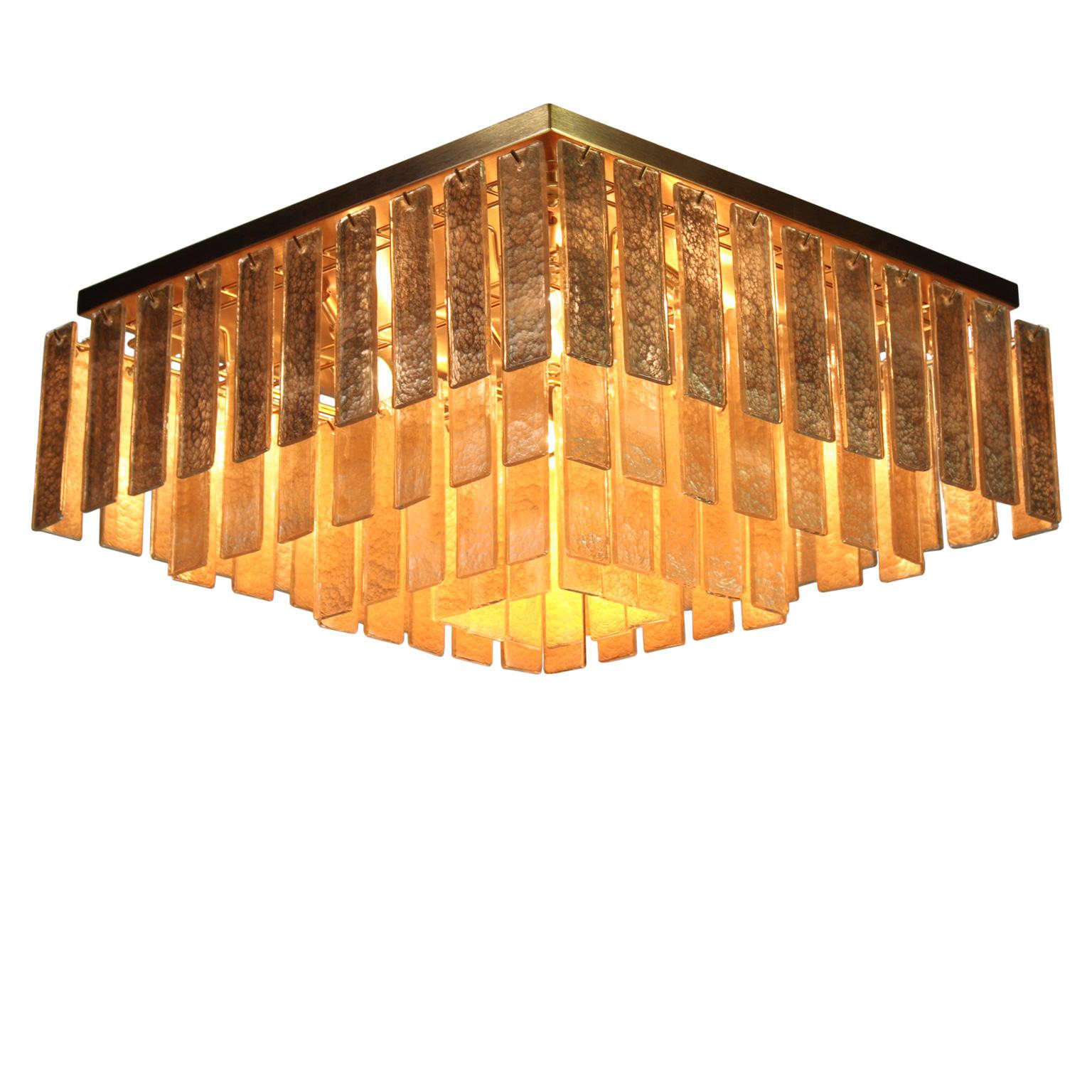 Charleston ceiling light with gold color glass listels, brushed gold fixture by Multiforme.
The modern style ceiling light Charleston, from our Progressive collection, is an extremely versatile lighting work that can be customized in many different