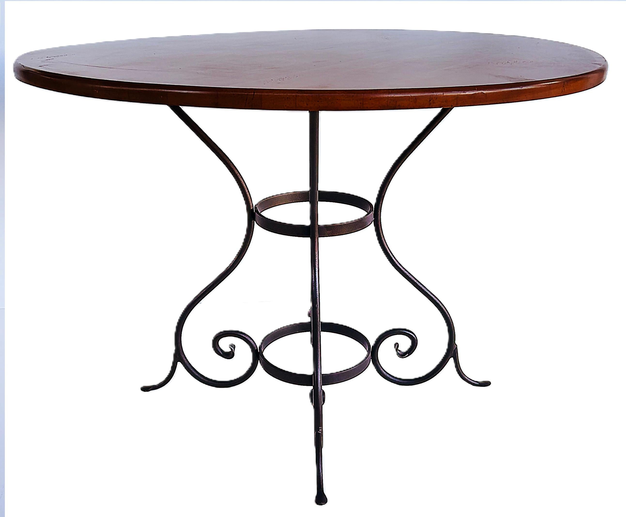 Charleston Forge Wood Dining Center Table, Wrought Iron Base

Offered for sale is a well made Charleston Forge wood center table or small dining table with a wood top and a wrought iron base. The base has four scrolled legs and retains the makers