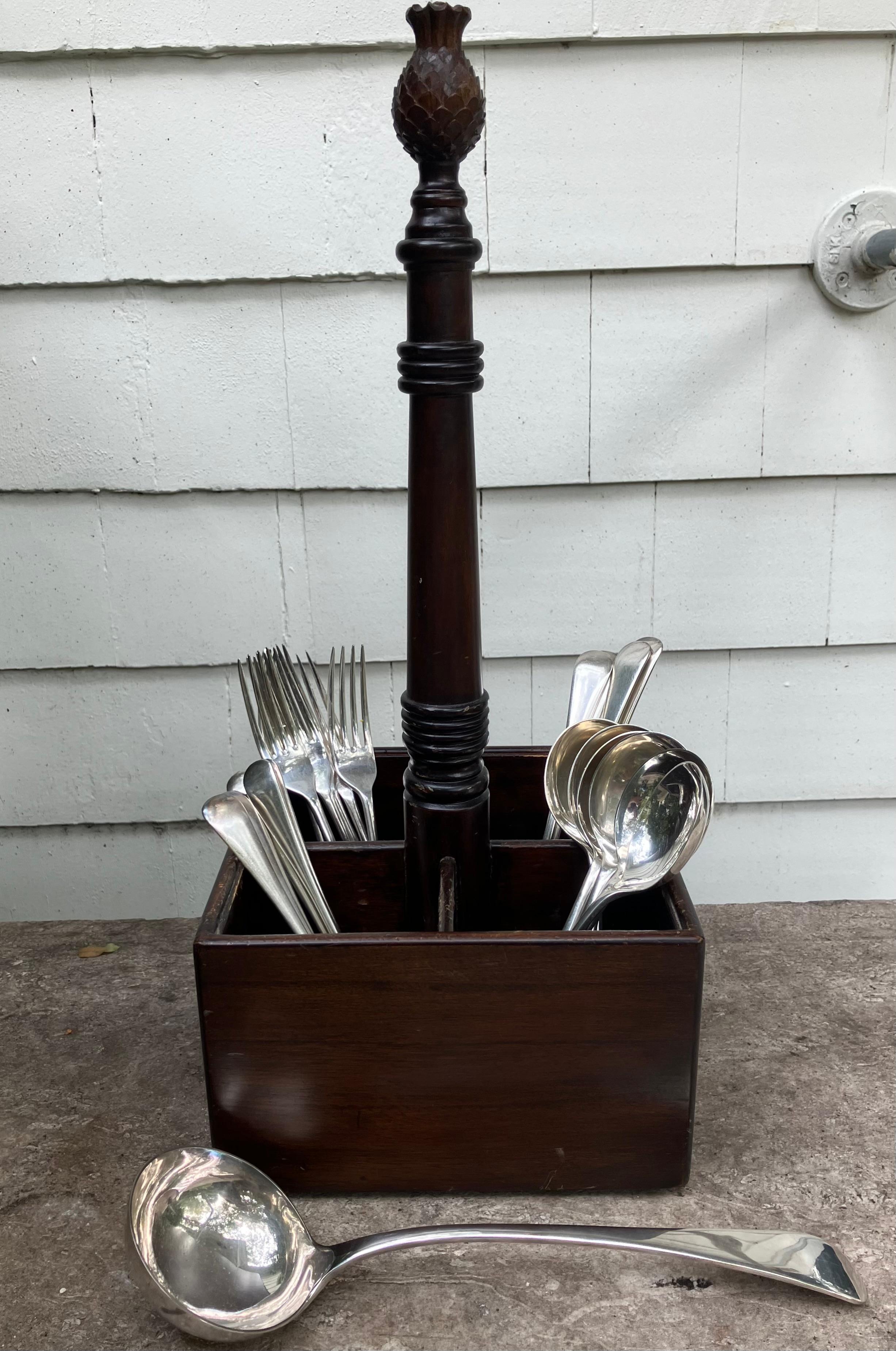 Charleston style wood carved cutlery holder divided into four, for entertaining ease with transporting vinegar olive oil and condiments or as a wine bottle carrier topped by carved pineapple the symbol of hospitality. 

Dimensions: 8” square base; 4