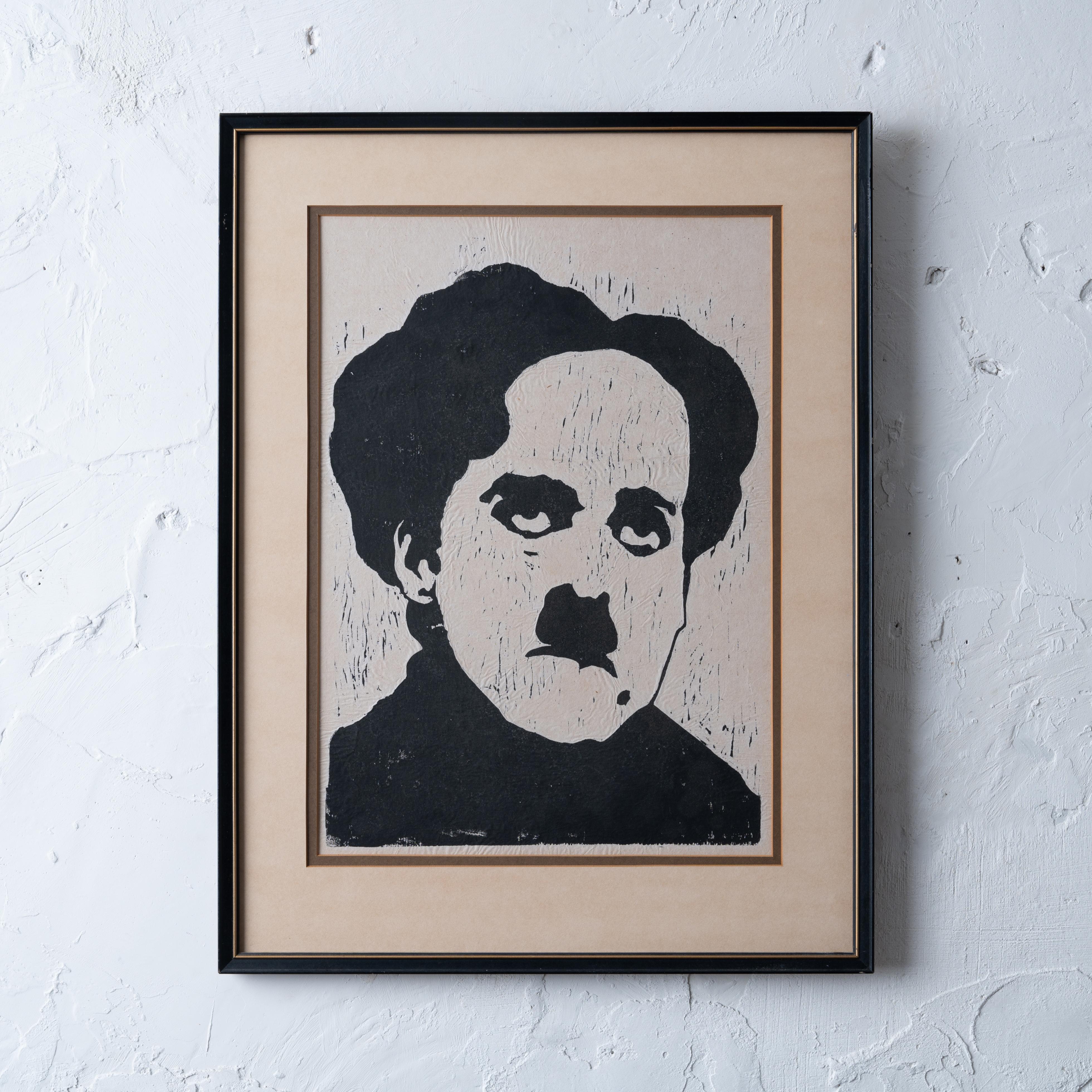 A Charlie Chaplin block print, unsigned, mid-20th century. 

sight: 11 ¾ by 16 ¾ inches
frame: 17 by 22 ½ inches


