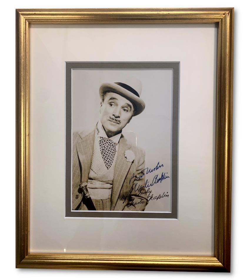 A signed photograph of Charlie Chaplin as his character from the controversial 1947 film Monsieur Verdoux

Charlie Chaplin was the biggest star of the silent era. Born into poverty in Victorian London, he found his way to the stage and on to