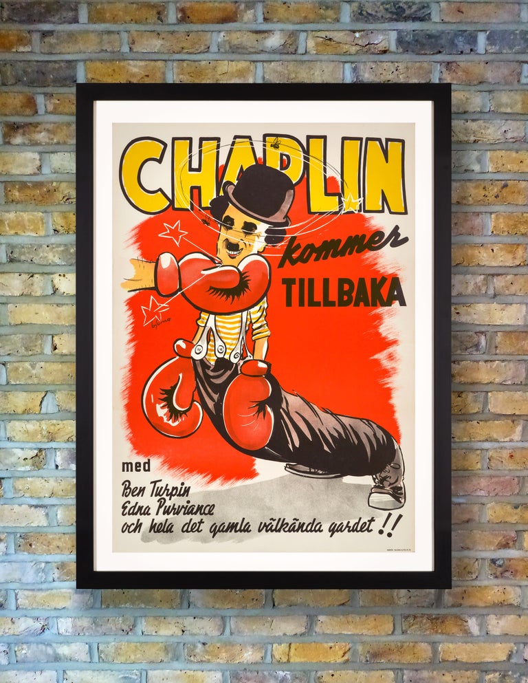 A bold, eye-catching poster for a 1944 Swedish re-release of the 1915 Charlie Chaplin silent boxing comedy short 'The Champion,' starring Chaplin as the sparring partner who wins the championship match. Chaplin had previously played a boxing referee