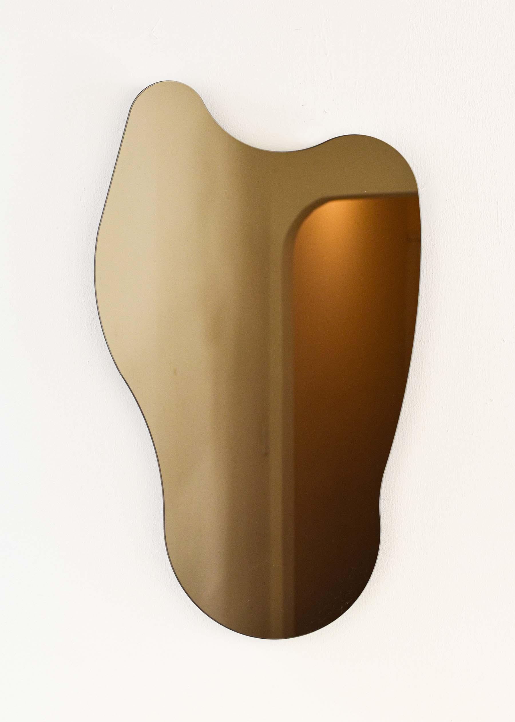 CHARLIE MIRROR
Materials: Bronze Glass, Black MDF
Dimensions: 19”W X .75”D X 31.75”H 

Minimalist, elegant, amorphically shaped floating bronze glass mirrors inspired by the topography of the Philippine archipelago. 

Artist Cheyenne Concepcion