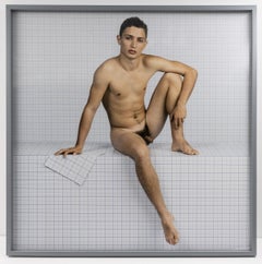 Naked Boy Sitting Down, Looking Towards Camera