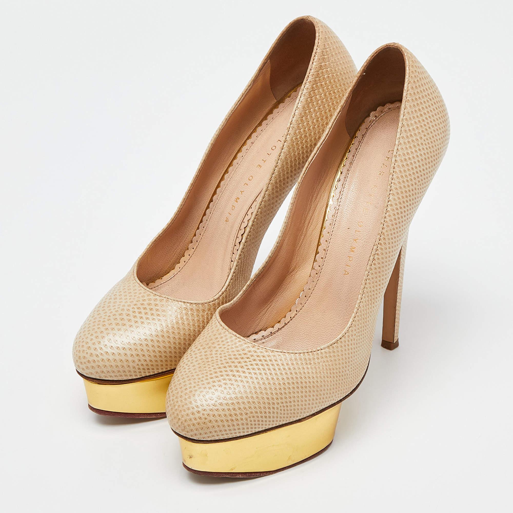 Crafted in a classy hue we love these Charlotte Olympia pumps. Designed to make a statement they have a sleek silhouette and a nice fit. Wear yours under maxi skirts for a peek of glamour or let them shine with cropped hemlines.