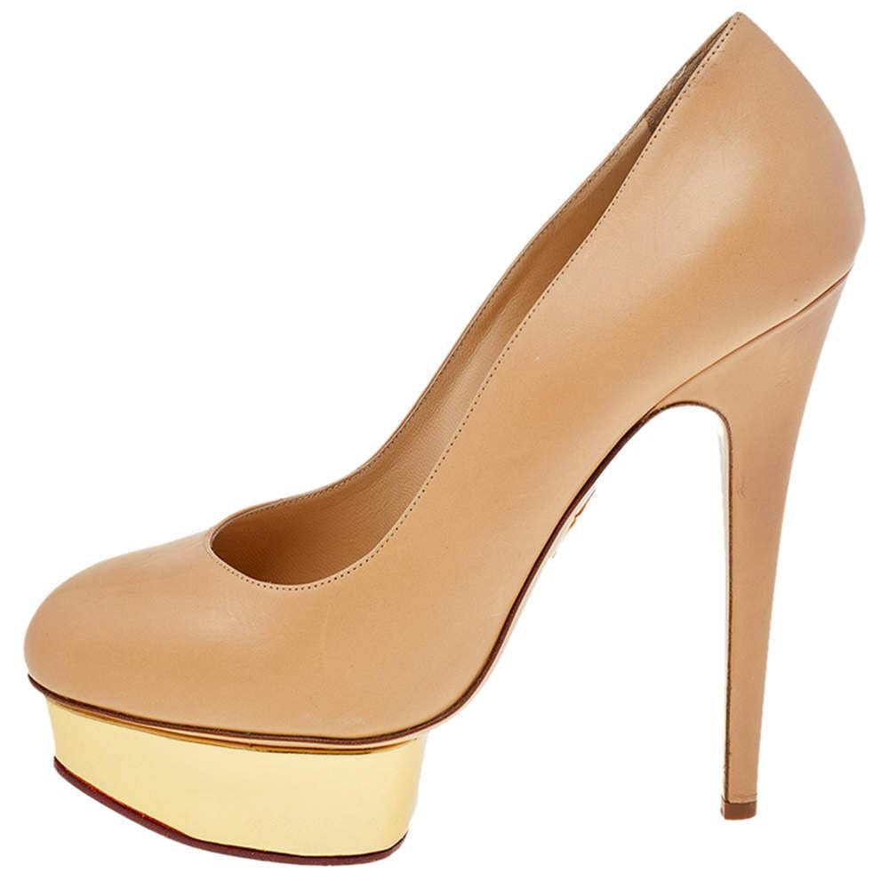 Own this meticulously designed pair of Charlotte Olympia pumps today and dazzle everyone whenever you step out Crafted out of leather and lined with leather on the insoles this creation is from their Dolly collection. They have been beautified with