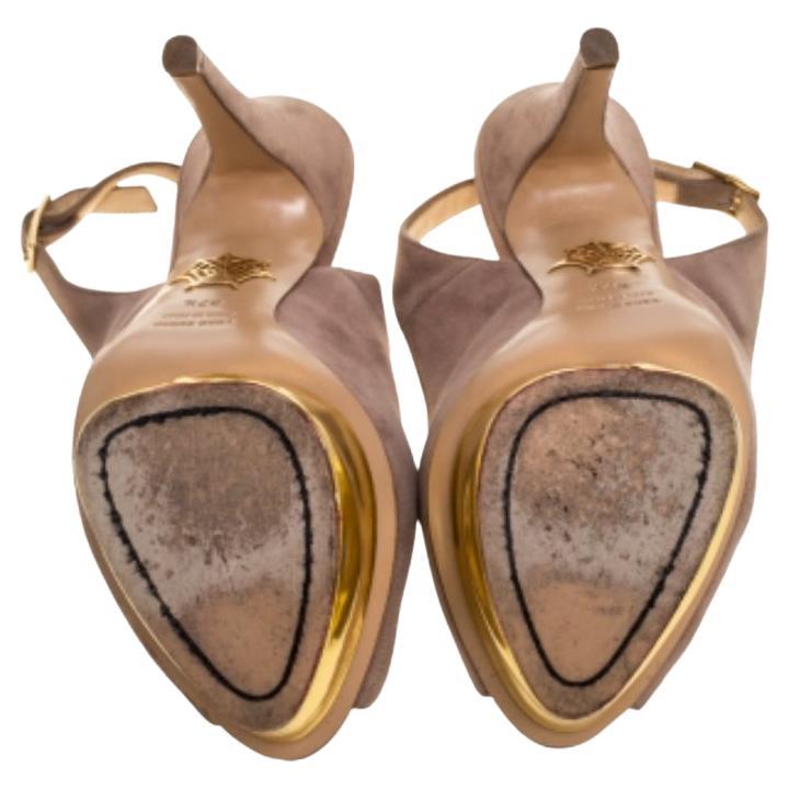 An elegant design propelled by high-quality materials and skillful craftsmanship. These Charlotte Olympia sandals in suede feature peep toes, slingbacks, brand label-detailed insoles, gold-tone platforms and 15 cm heels for an elegant lift.