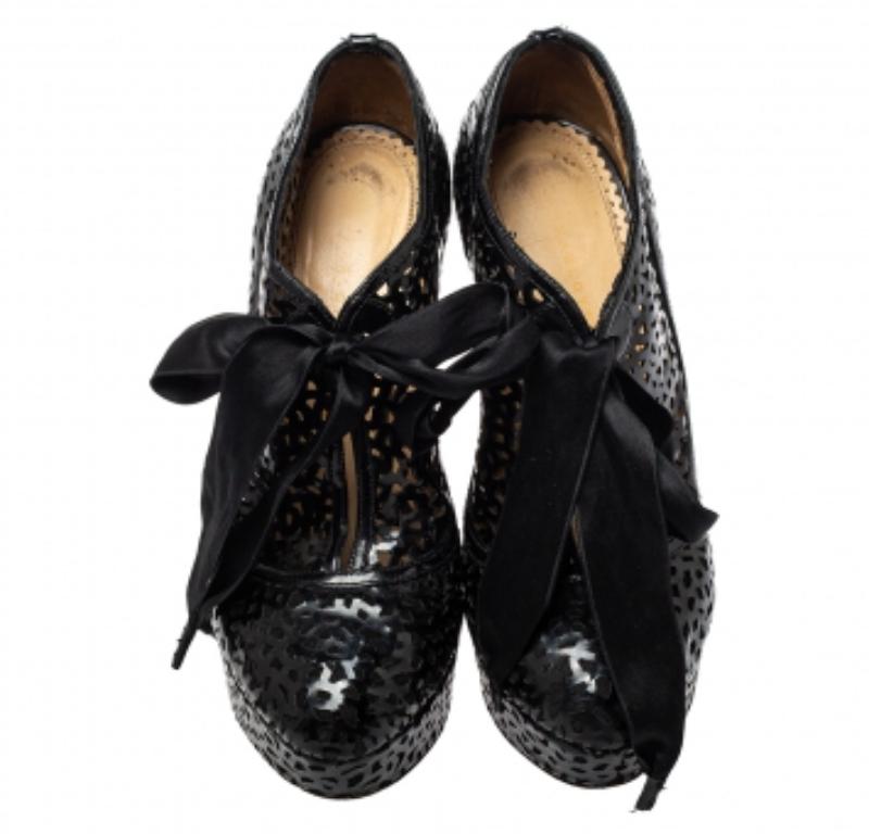 To complement your upbeat style, Charlotte Olympia brings you these gorgeous ankle booties that come flowing with high fashion. They've been crafted from leather and designed with cutout vamps, comfortable insoles, platforms and 13.5 cm heels.