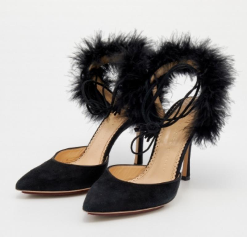 Put your best foot forward this season in these pretty Charlotte Olympia sandals. The black sandals have been crafted using ostrich feathers and suede and they feature ankle ties as well as smooth insoles meant to provide comfort at every step.