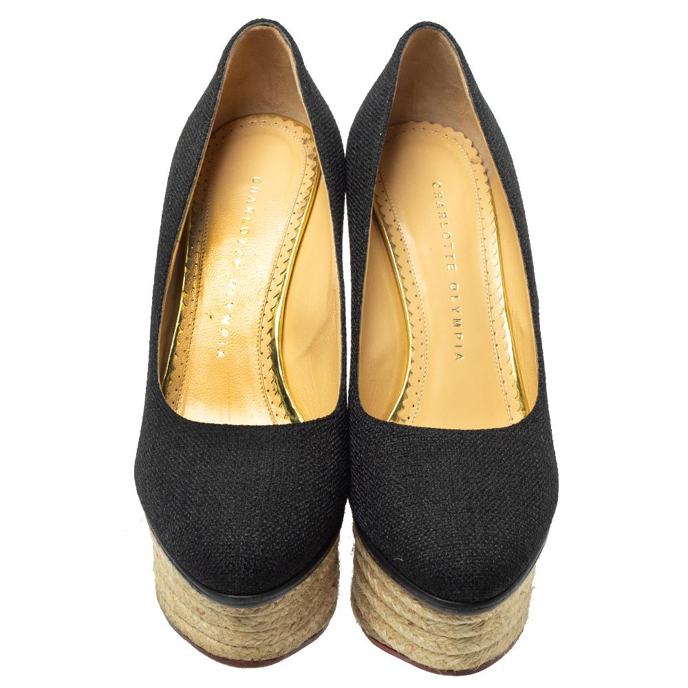 Well, isn't this Charlotte Olympia pair simply stunning! The pumps have been designed so beautifully with raffia in a black hue that they make one's heart flutter. They come in a simple design of espadrille platform wedges, which gives the pair full