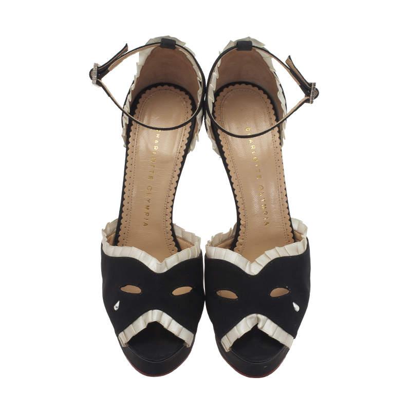 Add an unrivalled touch of style with this Charlotte Olympia black sandals. Crafted from black satin, they feature cream pleated satin trims, mask-effect cutout vamps with clear crystal teardrop and open almond toes. They also come with