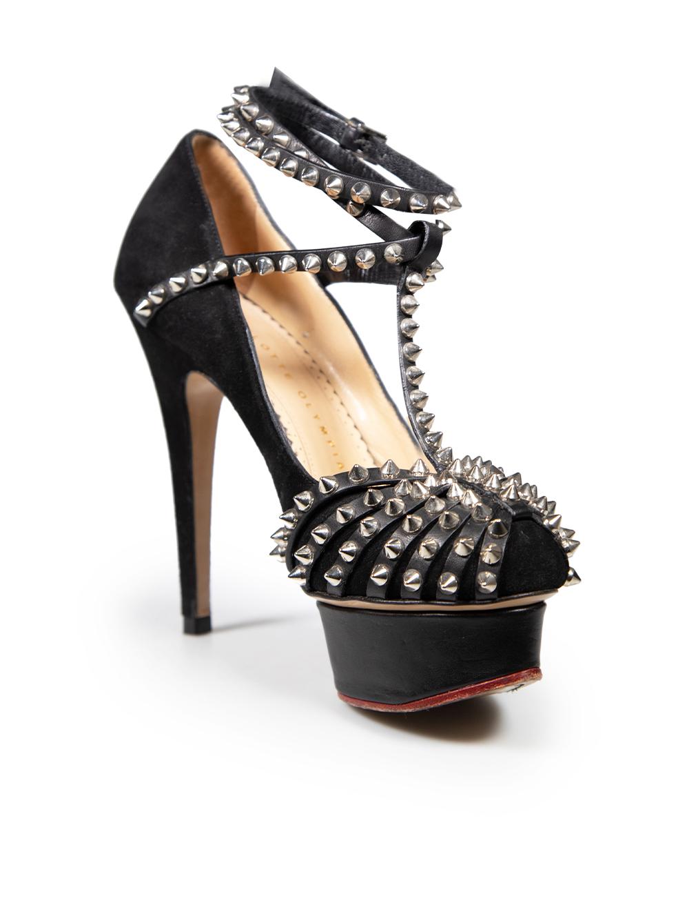CONDITION is Good. General wear to heels is evident. There are areas of marking along the insoles. The main body and soles soles have abrasions and discolouration, pluck to weave on the right shoe from use on this used Charlotte Olympia designer