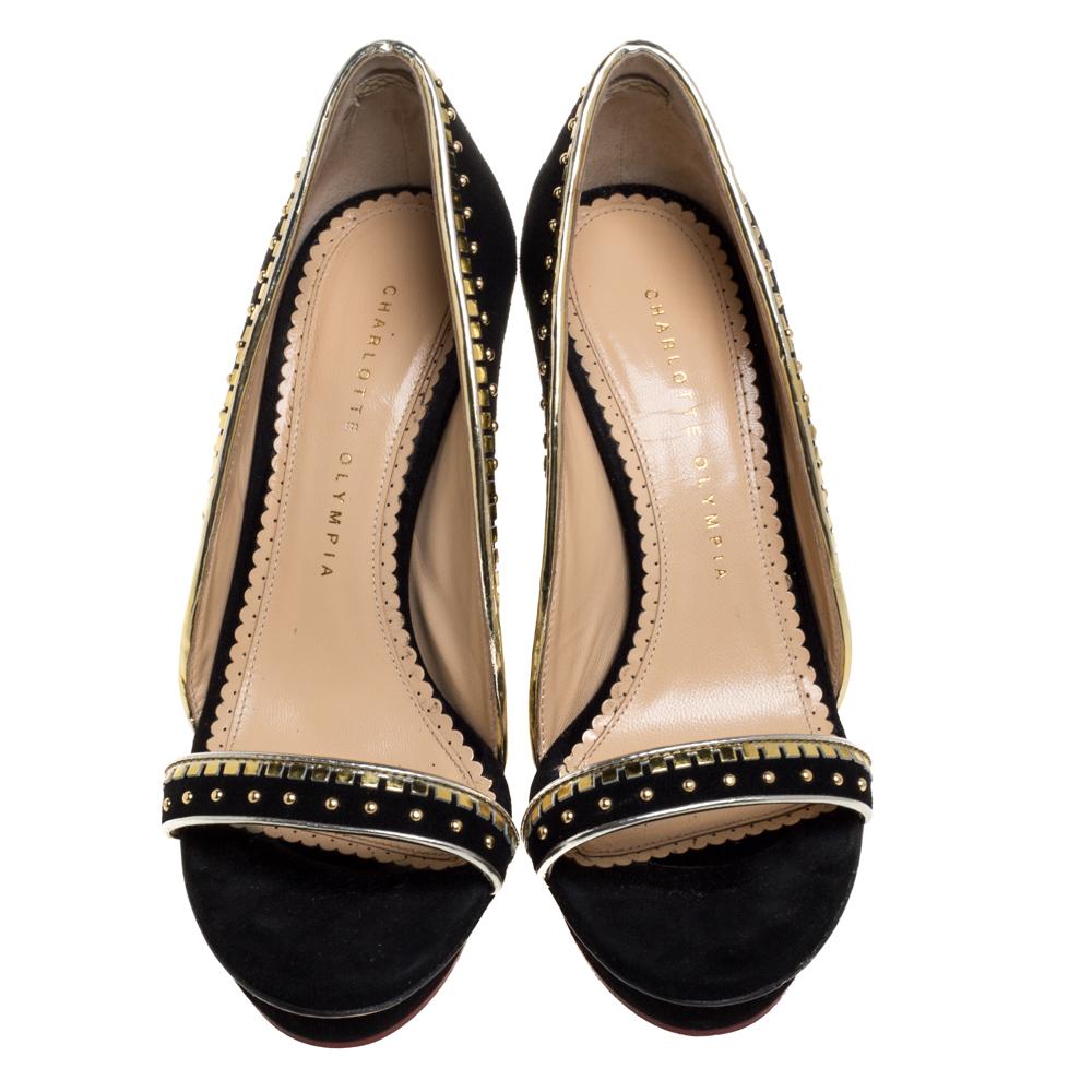 Introduce your shoe closet to an addition as magnificent as this pair of pumps from Charlotte Olympia! These black pumps have been artistically crafted from suede and designed with details such as open toes and 12 cm gorgeous heels. The metallic