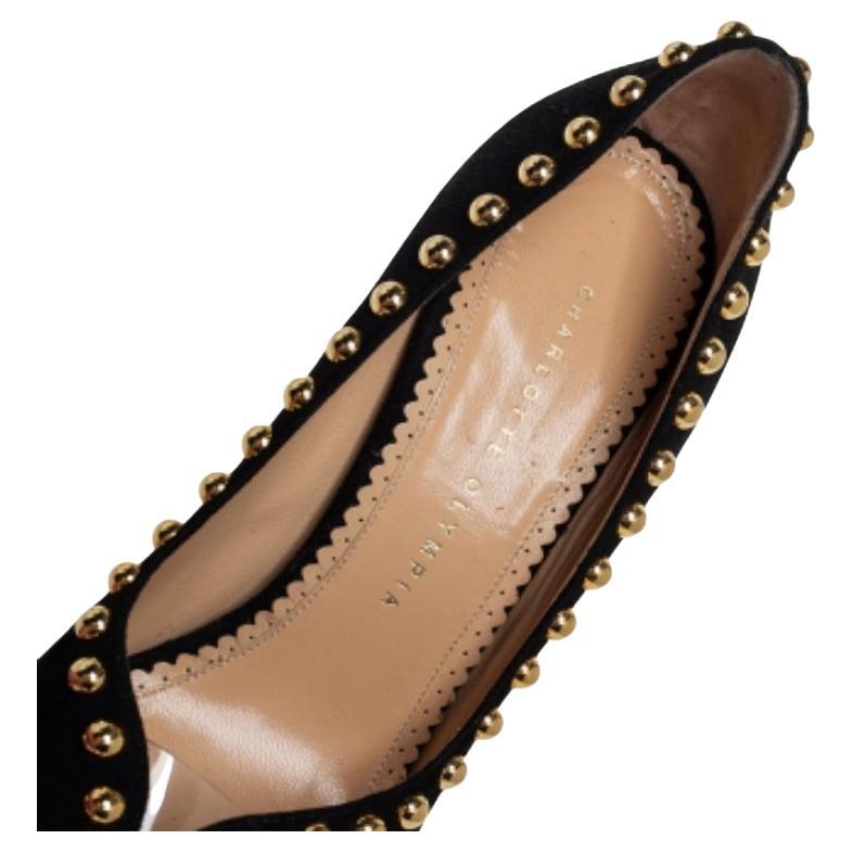 These pumps from Charlotte Olympia are love at first sight! The black beauties are exquisitely crafted from suede and designed to please the eyes of the beholder. They flaunt peep toes, gold-tone stud embellishments, well-cut platforms, and 15 CM