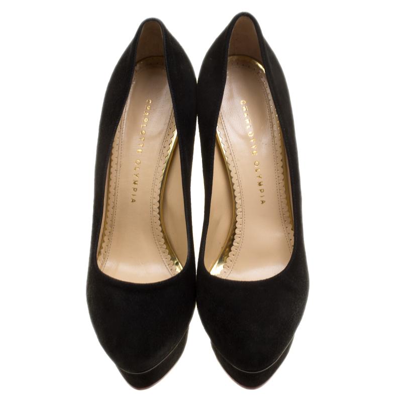 You are sure to impress everyone whenever you step out in these pumps from Charlotte Olympia! Crafted out of suede in a classy black shade and lined with leather on the insoles, this number is from their Dolly collection. They've been beautified