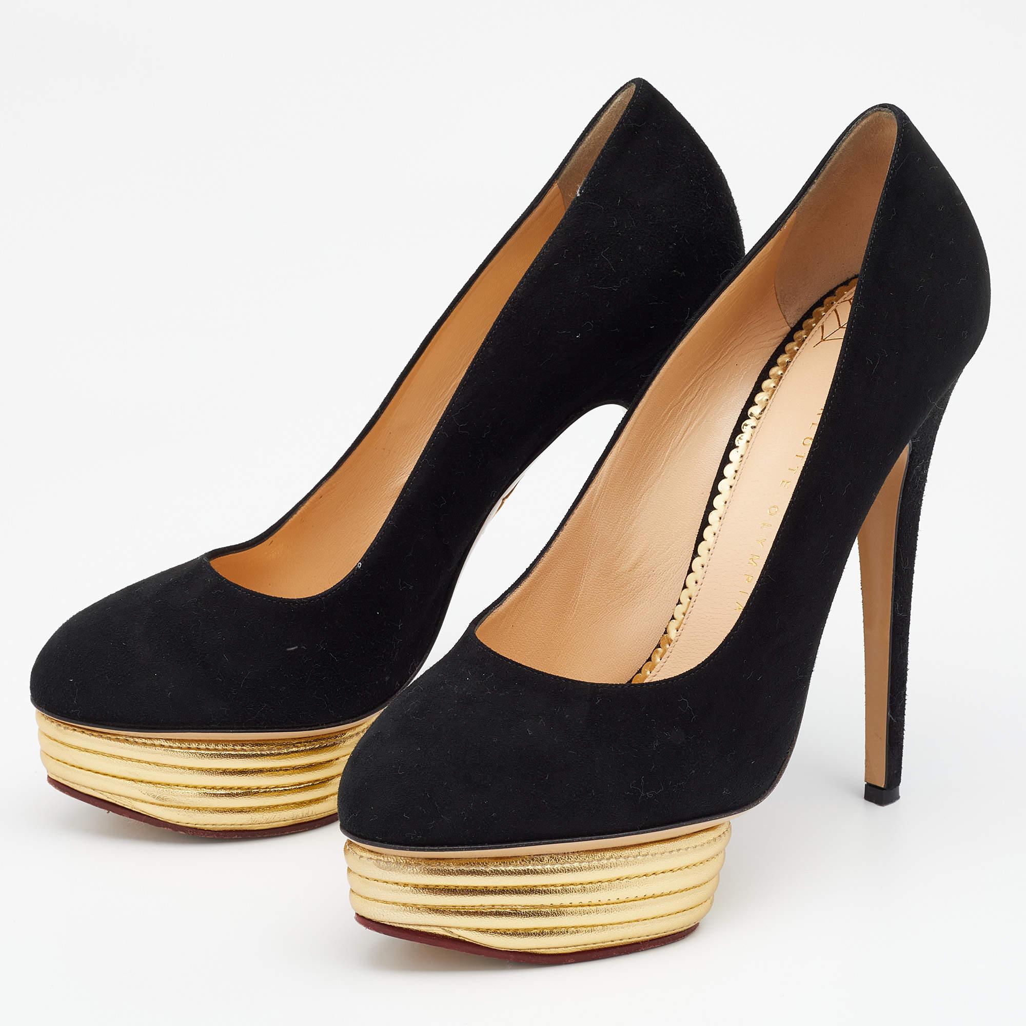 Make a statement with this pair of Charlotte Olympia Dolly pumps. Crafted using black suede and lined with leather on the insoles, this creation is beautified with high heels and gold-tone platforms.