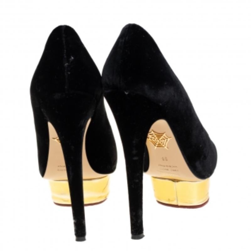Own this meticulously designed pair of Charlotte Olympia pumps today and dazzle everyone whenever you step out! Crafted out of velvet and exhibiting almond toes, these pumps are from their Dolly collection. They are lined with leather on the insoles