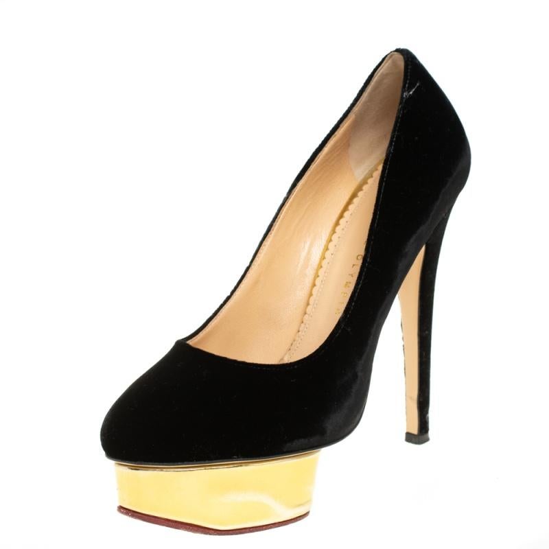 Own this meticulously designed pair of Charlotte Olympia pumps today and dazzle everyone whenever you step out! Crafted out of velvet and exhibiting almond toes, these pumps are from their Dolly collection. They are lined with leather on the insoles