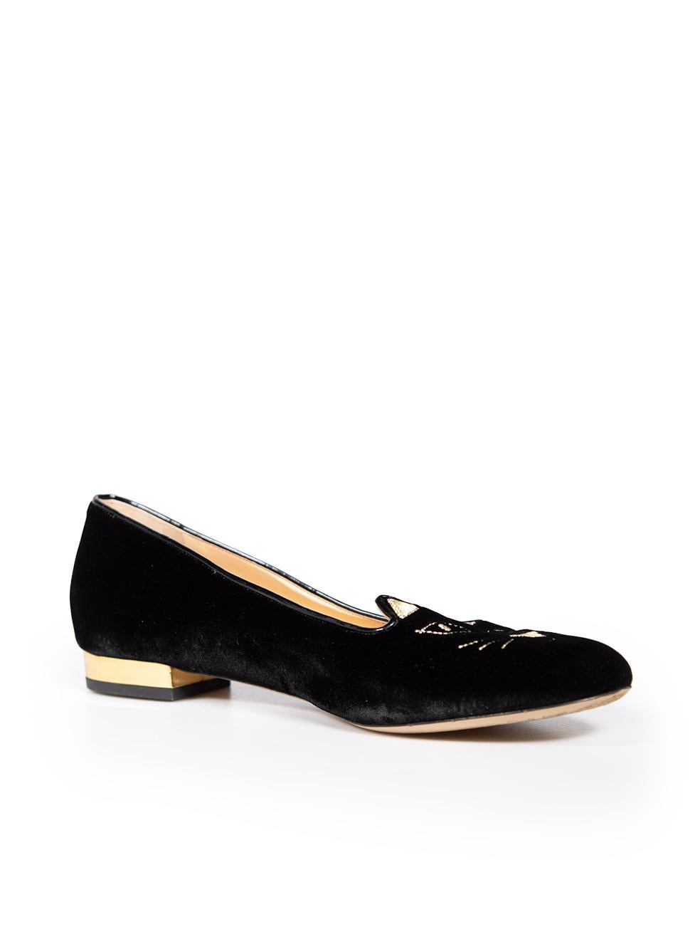 CONDITION is Very good. Minimal wear to the flats is evident. Small scratches to the left side of the right shoe and the front, back and heels of both shoes on this used Charlotte Olympia designer resale item. This item comes with original shoe