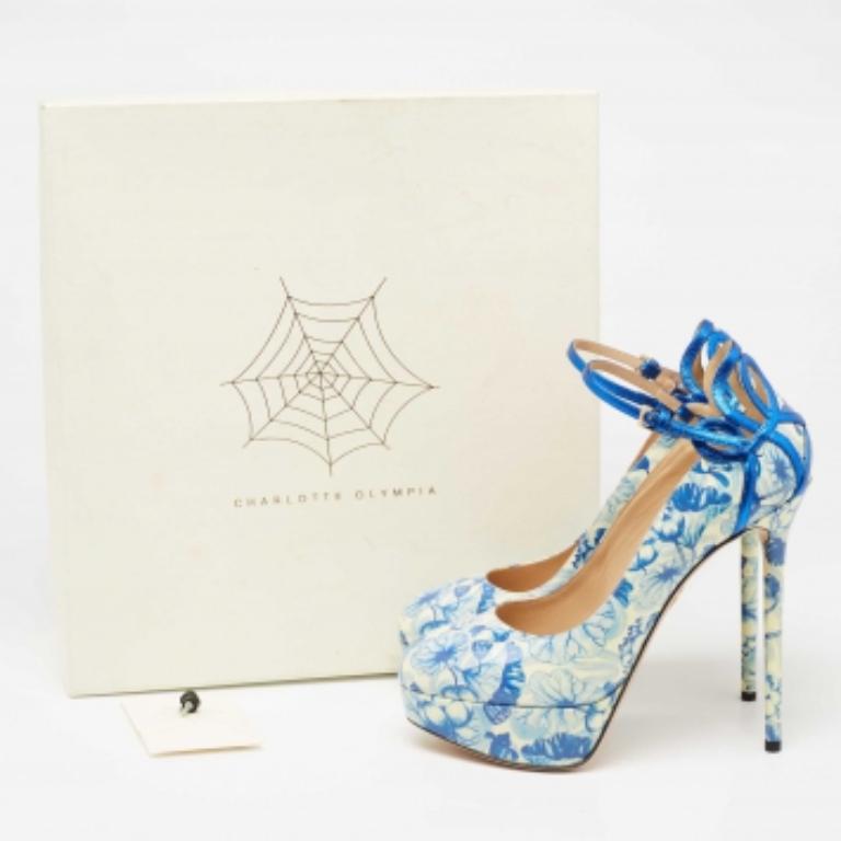 Released as part of their Shanghai Express collection, these Charlotte Olympia pumps are crafted from patent leather and designed with 'Koi Carp' prints. The beautiful shoes are balanced on platforms and slim heels.