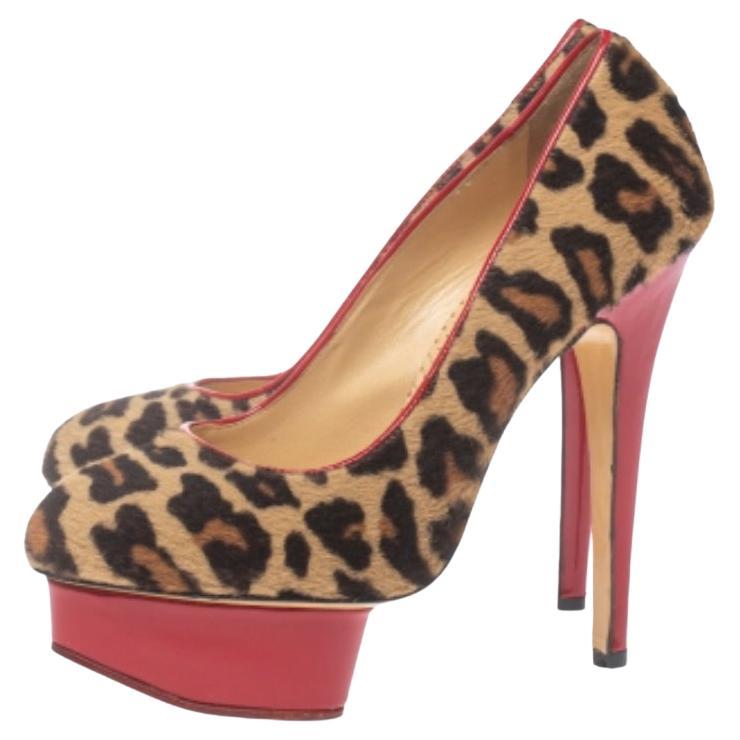 Get a showstopper look when you wear these stunning Charlotte Olympia pumps. They have been crafted from calfhair and feature leopard print for a chic look. Chunky platforms and 14 cm towering heels add to the beauty of these pumps.