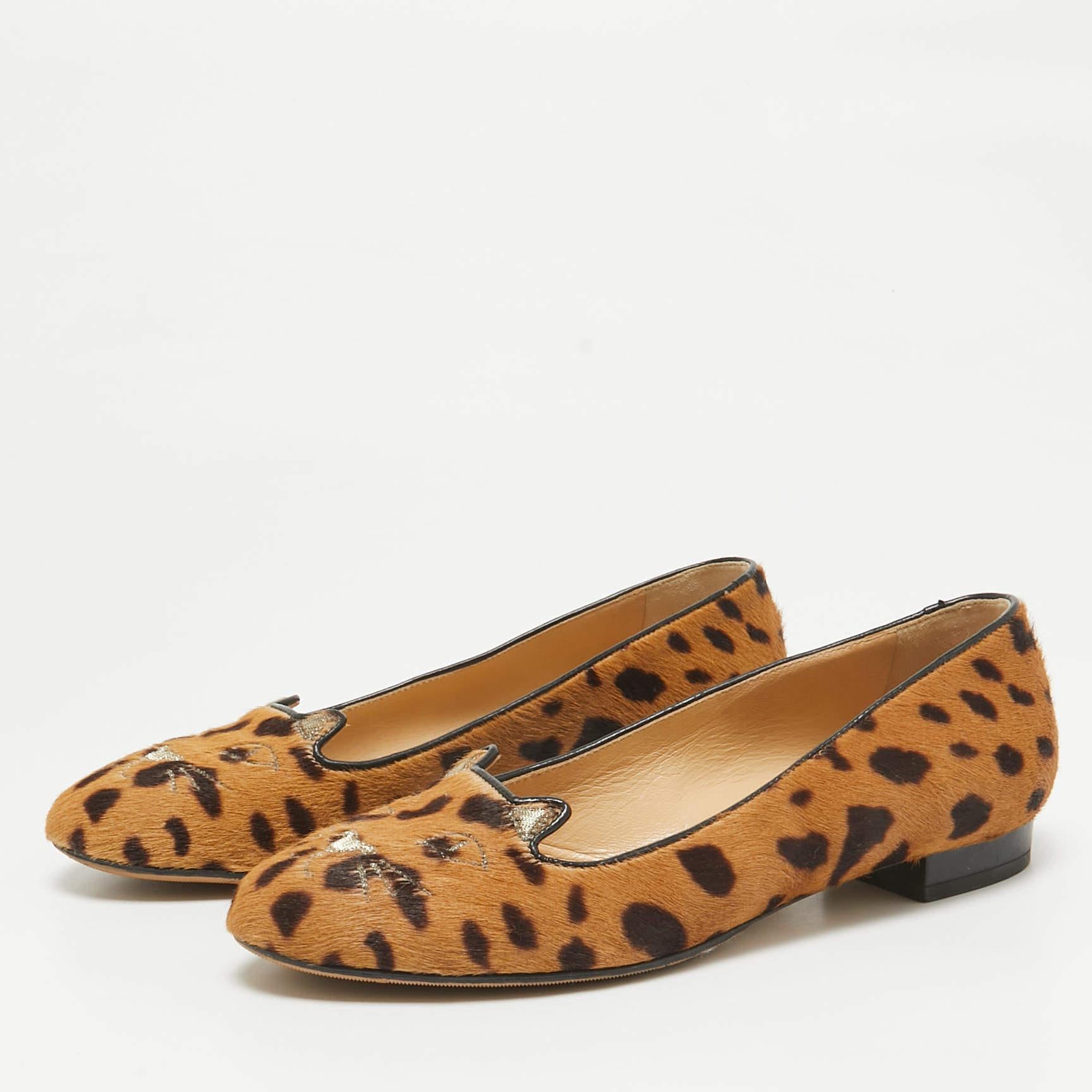 Spend a happy day in these Charlotte Olympia ballet flats. They are fashioned in leopard printed calf hair and feature cat detailing on the round toes.