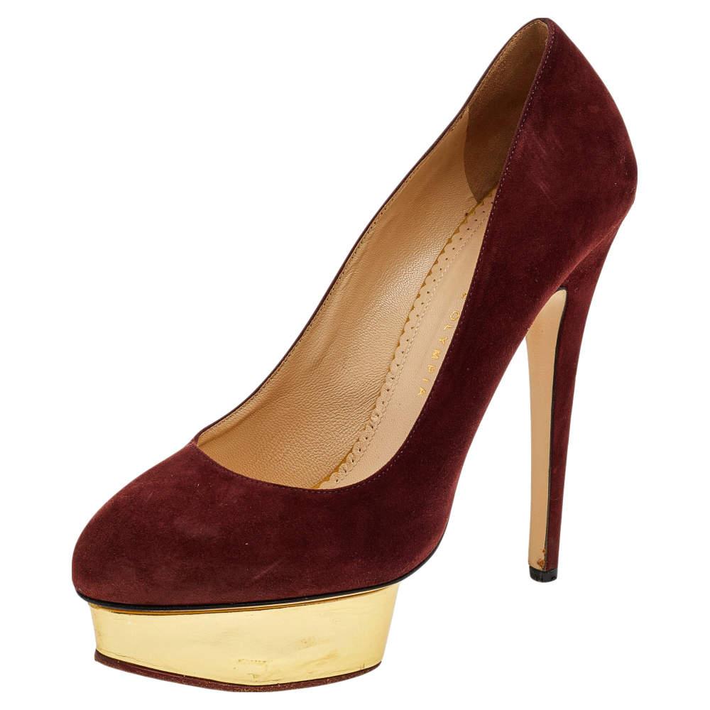 Own this meticulously designed pair of Charlotte Olympia pumps today and present a dazzling style Crafted out of suede and lined with leather on the insoles this creation from the Dolly collection is a must have. They have been beautified with 15.5