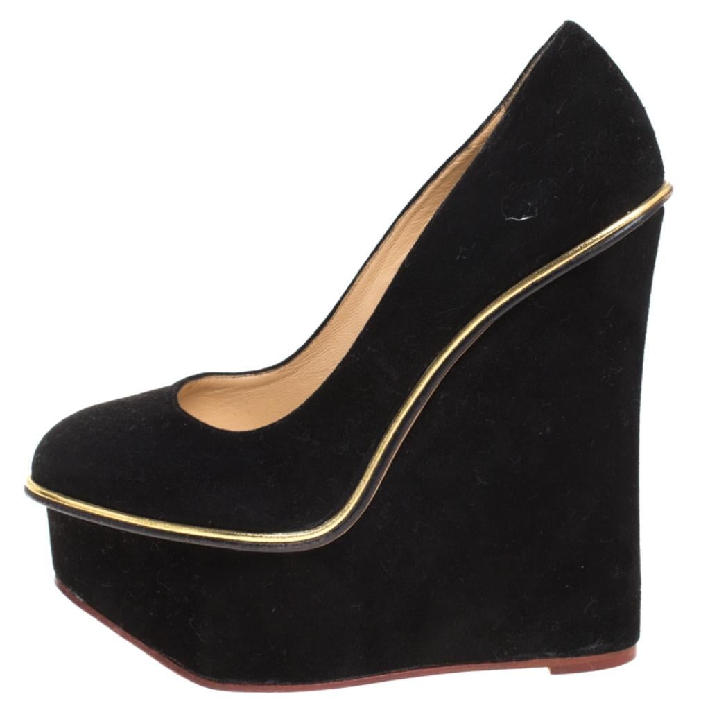 Well, isn't this Charlotte Olympia pair simply stunning! The pumps have been designed so beautifully with suede that they make one's heart flutter. They come in a simple design of platforms and 15.5 cm wedges which give the pair full marks on