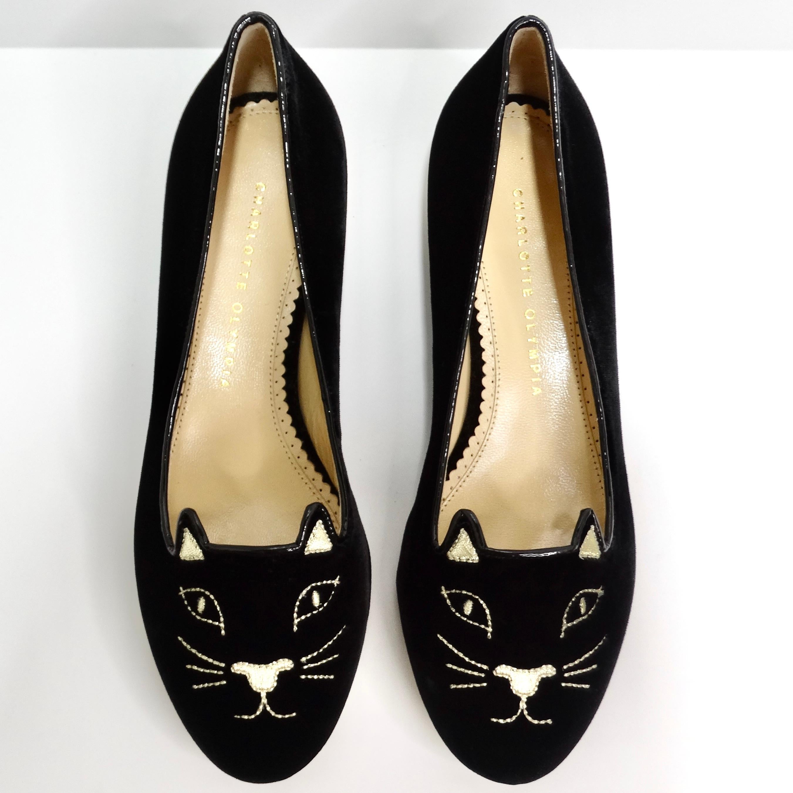 Introducing the Charlotte Olympia Designer Signed Kitty Embroidered Flats, the ultimate playful statement piece for cat lovers. These black velvet flats feature a delightful metallic gold kitty cat embroidery on the toe, adding a touch of whimsical