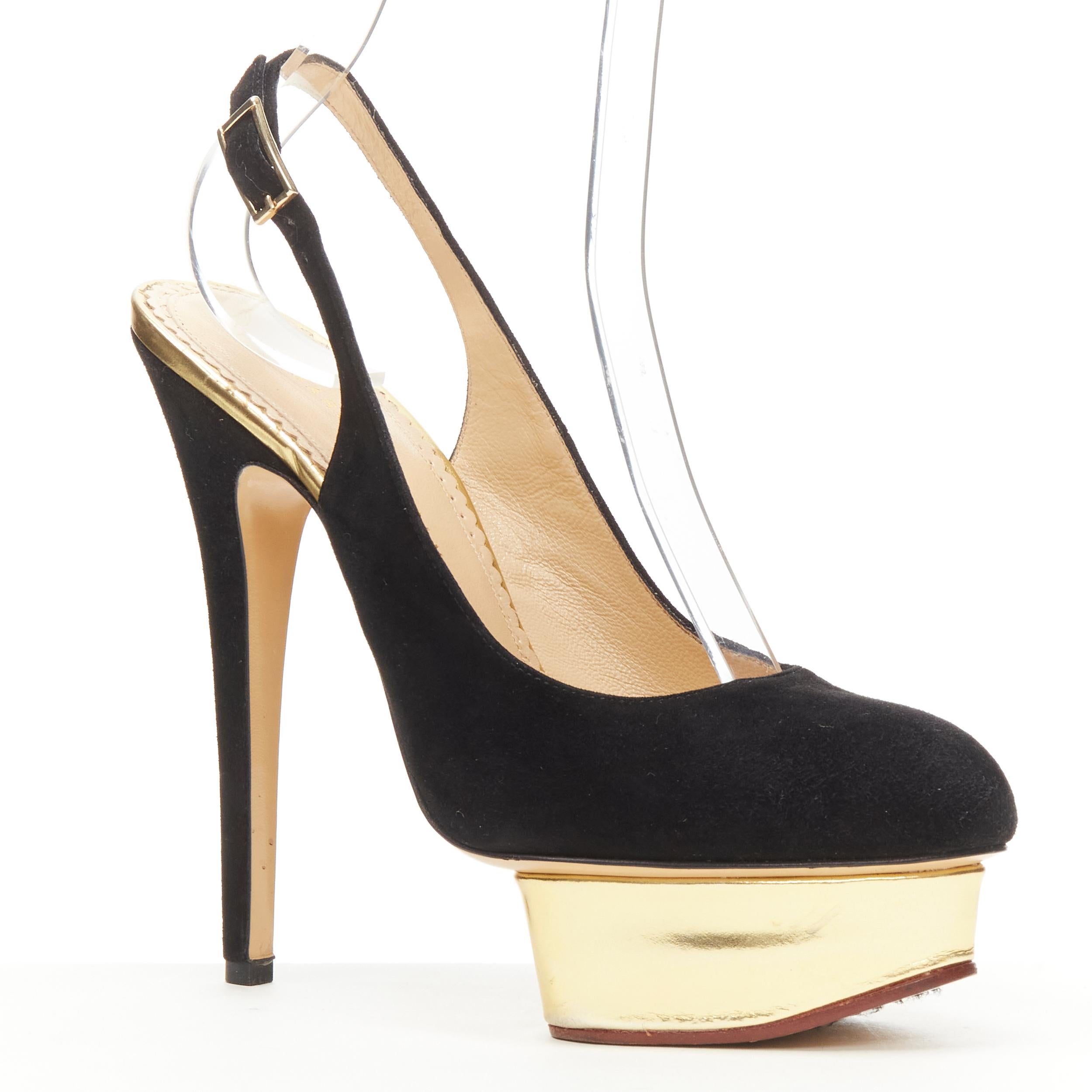 CHARLOTTE OLYMPIA Dolly black suede gold platform sling back pump EU38 
Reference: KEDG/A00125 
Brand: Charlotte Olympia 
Collection: Dolly 
Material: Suede 
Color: Black 
Pattern: Solid 
Closure: Slingback 
Made in: Italy 

CONDITION: 
Condition: