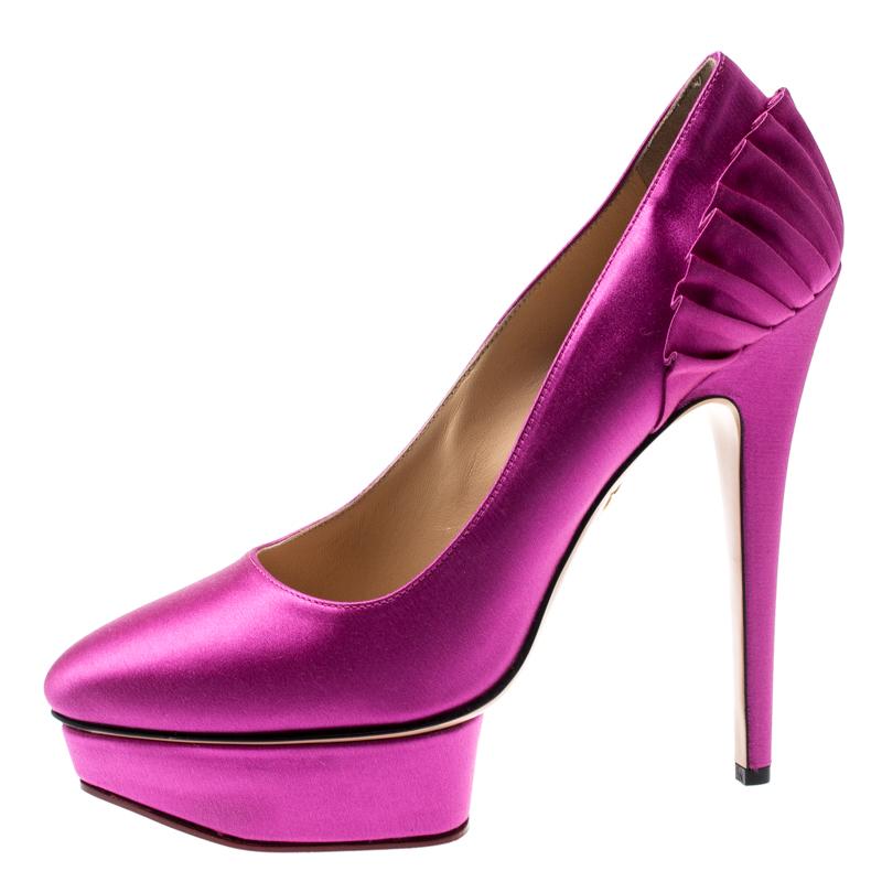 These Charlotte Olympia pumps are brilliantly designed in the graceful pink shade, Crafted with the rich taste of satin and detailed with a ruffle pattern on the counters. The classy pumps feature a heel of height 15.5cm supported by a platform of