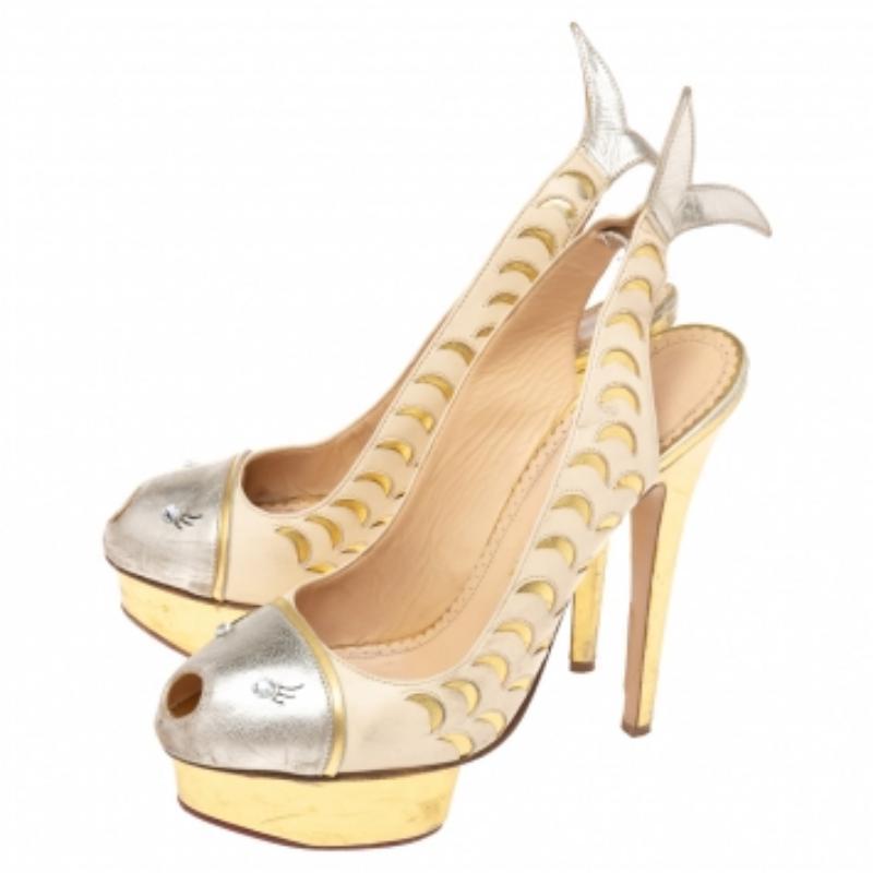 Charlotte Olympia presents to you these stunning slingback pumps for special occasions. Crafted with gold-hued leather, they flaunt an eye-catching and unique fish design swimming from the vamps to the counters. These Catch of the Day pumps come