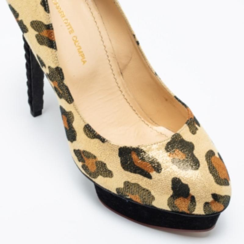 Grab these gorgeous Dolly pumps from the House of Charlotte Olympia, and walk confidently with elegant grace! Fashioned in gold leopard-printed glitter suede, these pumps are enhanced with rounded toes, platforms, and tall 14 cm heels. These pumps